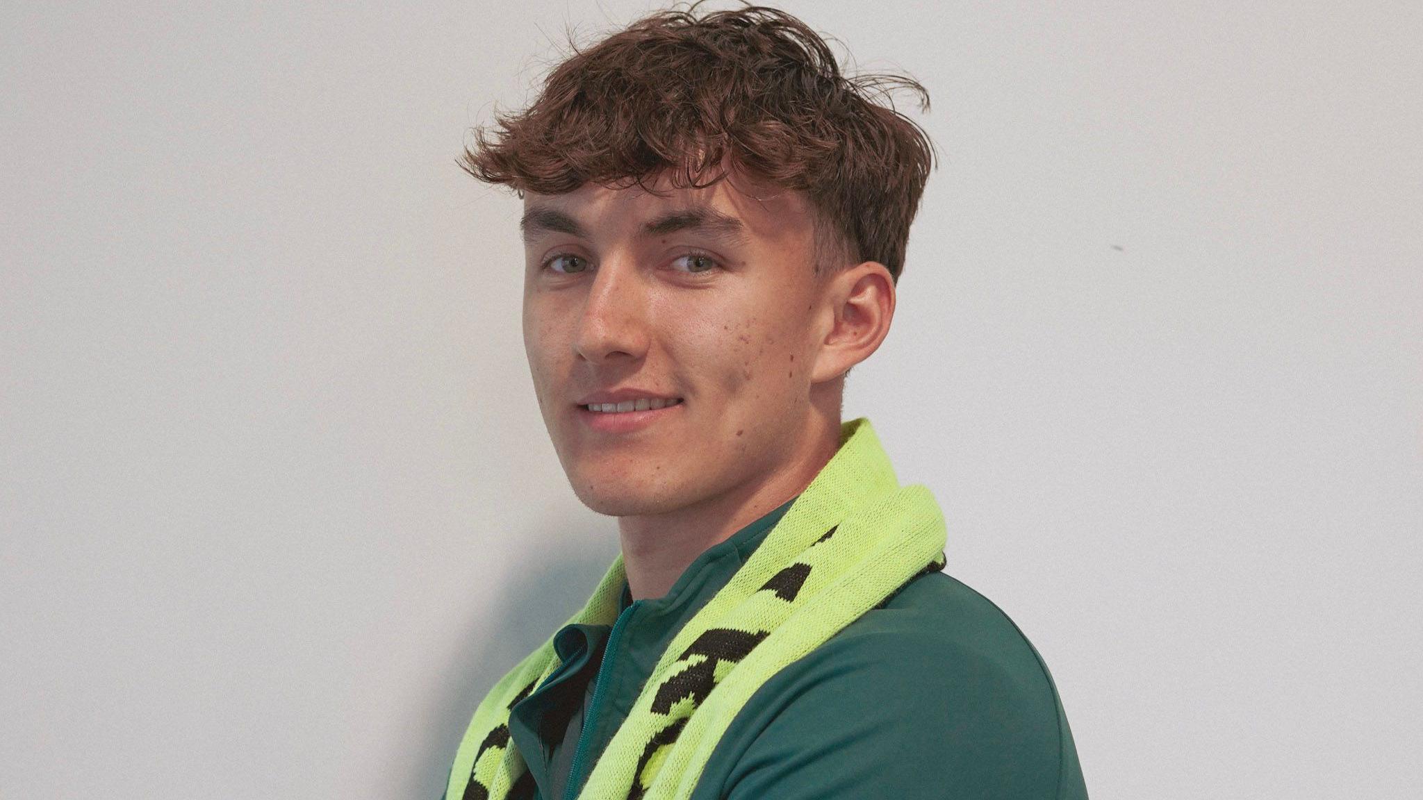 Aidan Dausch, wearing a Forest Green Rovers scarf