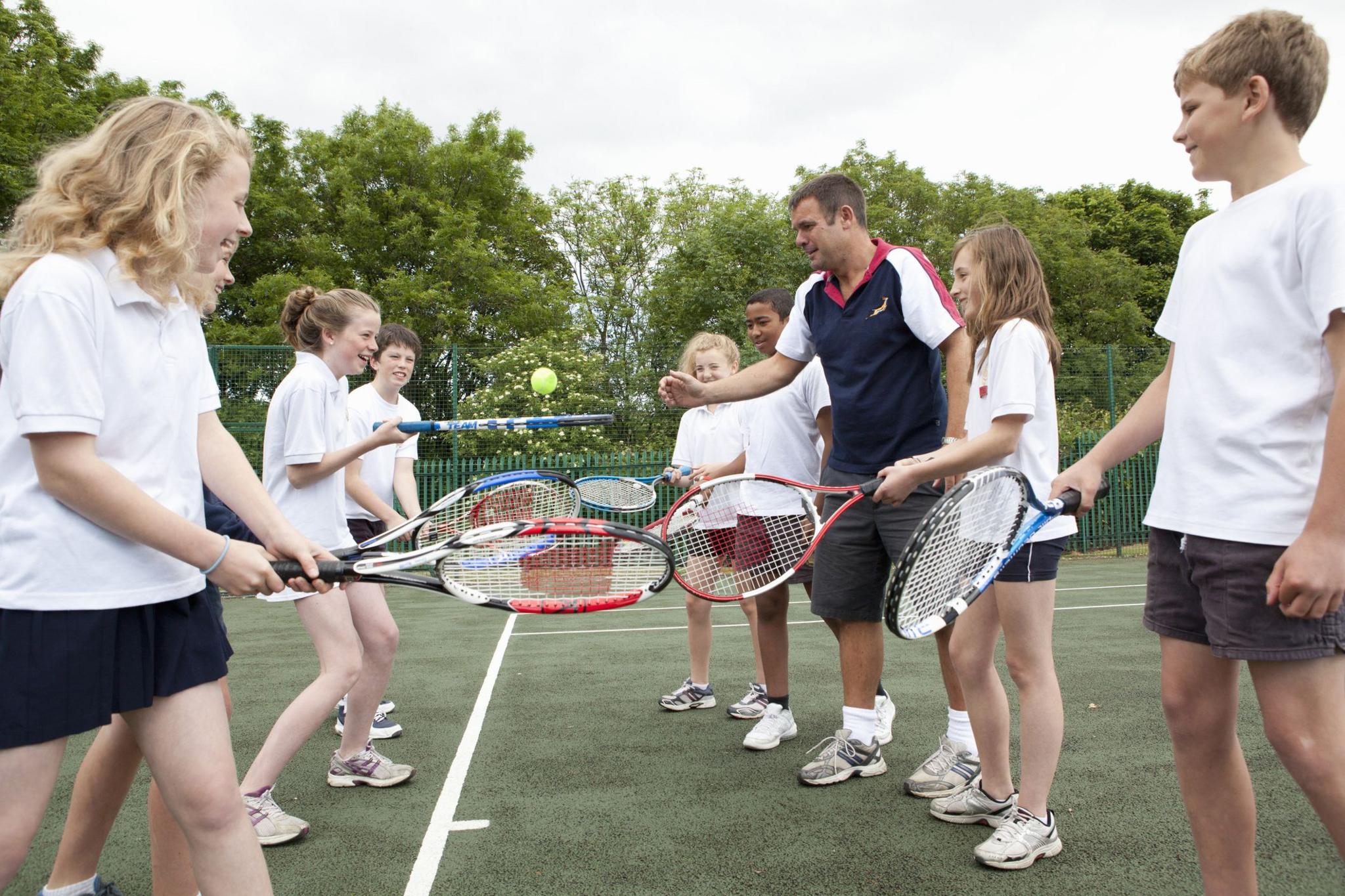 children playing tennis. 