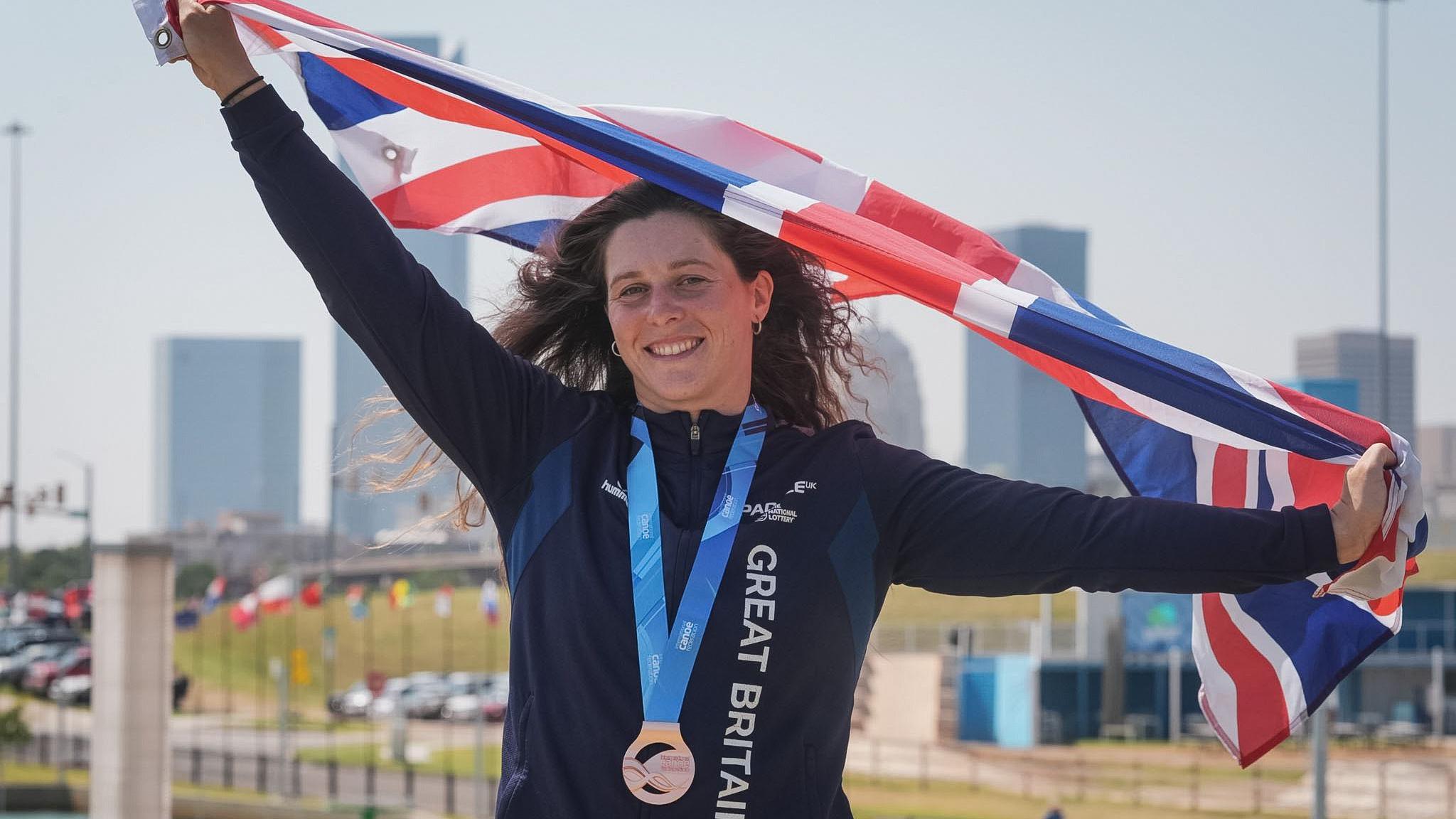 Kimberley Woods poses with bronze medal at ICF World Championships