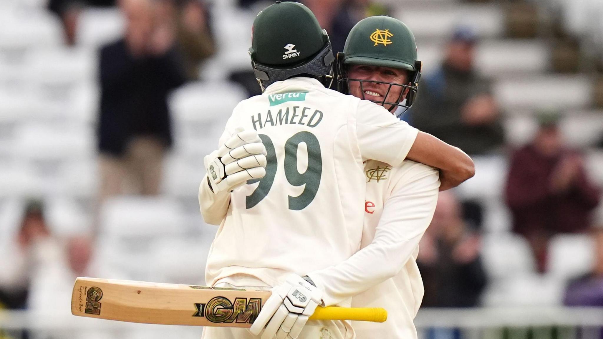 Haseeb Hameed and Ben Slater embrace after completing the win over Warwickshire