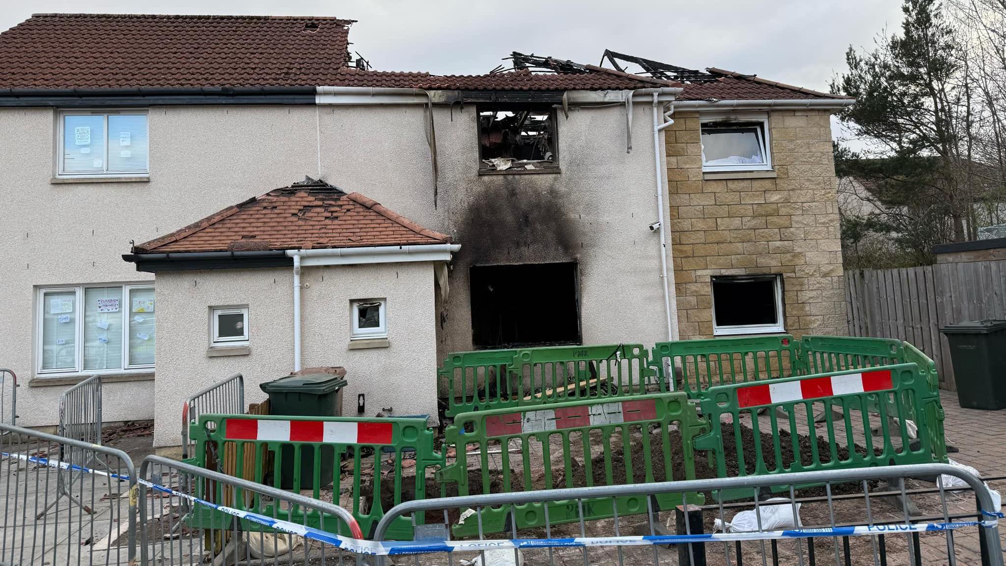 A general view of the fire-damaged house in the Hay Drive area of Niddrie.