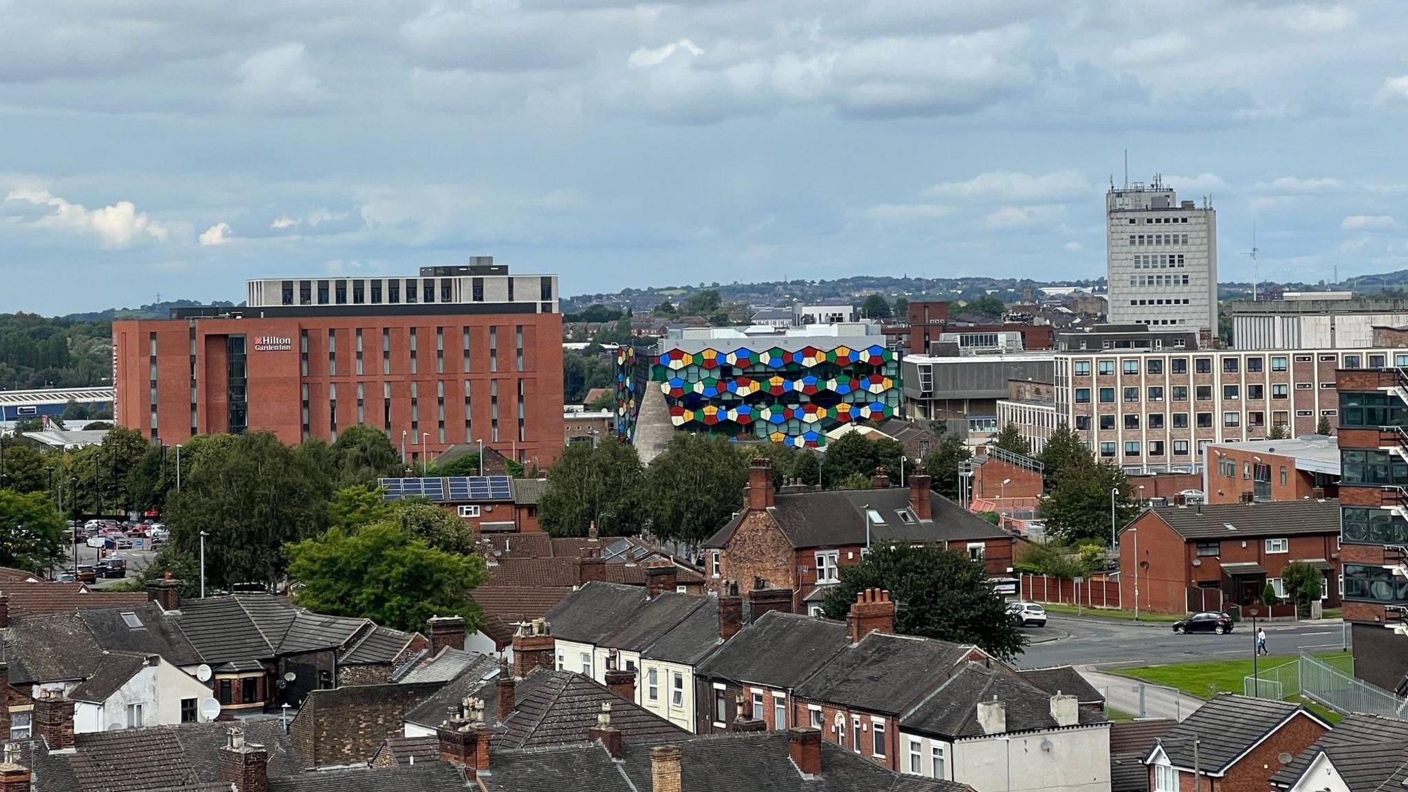 An aerial view of Hanley. Prominent landmarks in the shot include the Hilton hotel, the Smithfield development and the former BT building. In the foreground is housing.