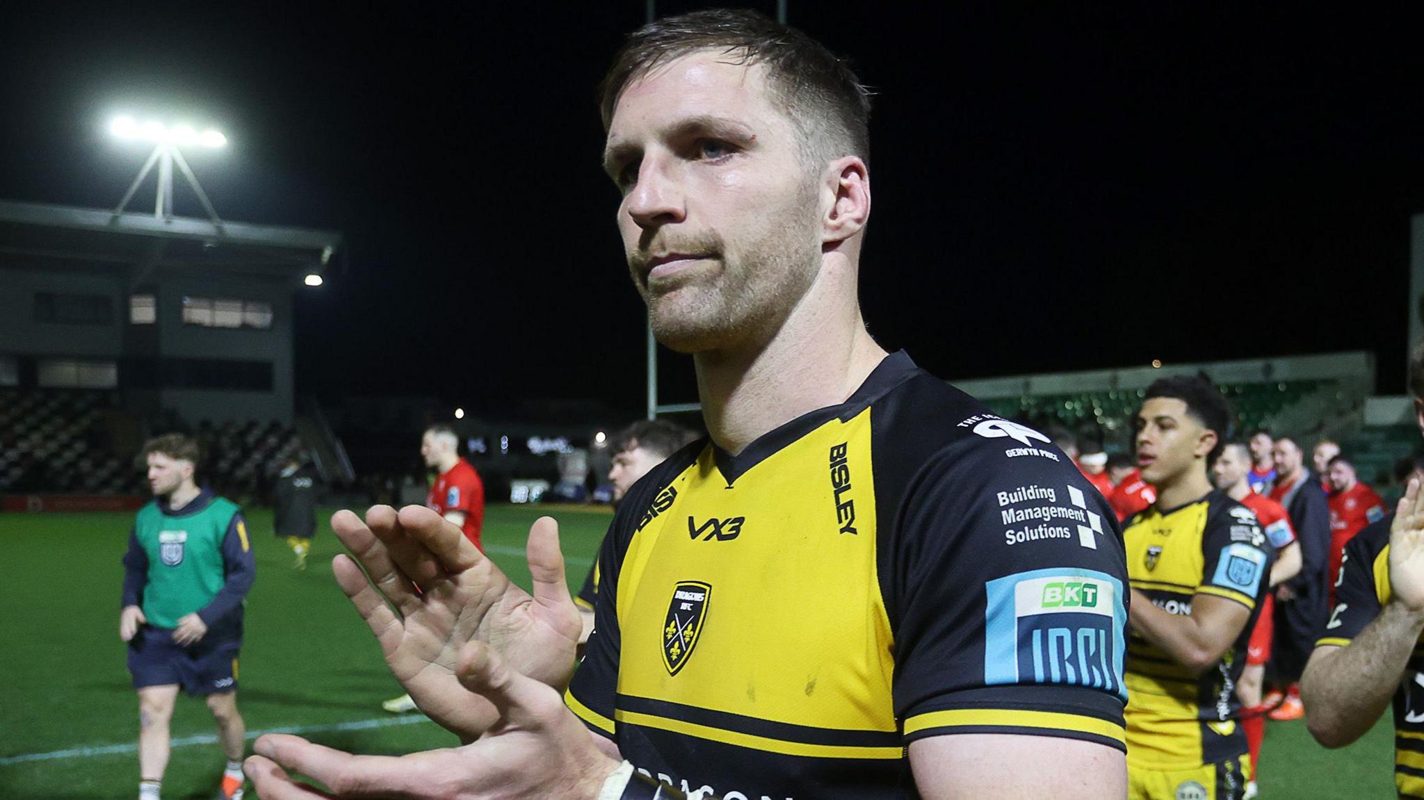 Dragons lock Steve Cummins applauds supporters after the game against Ulster at Rodney Parade