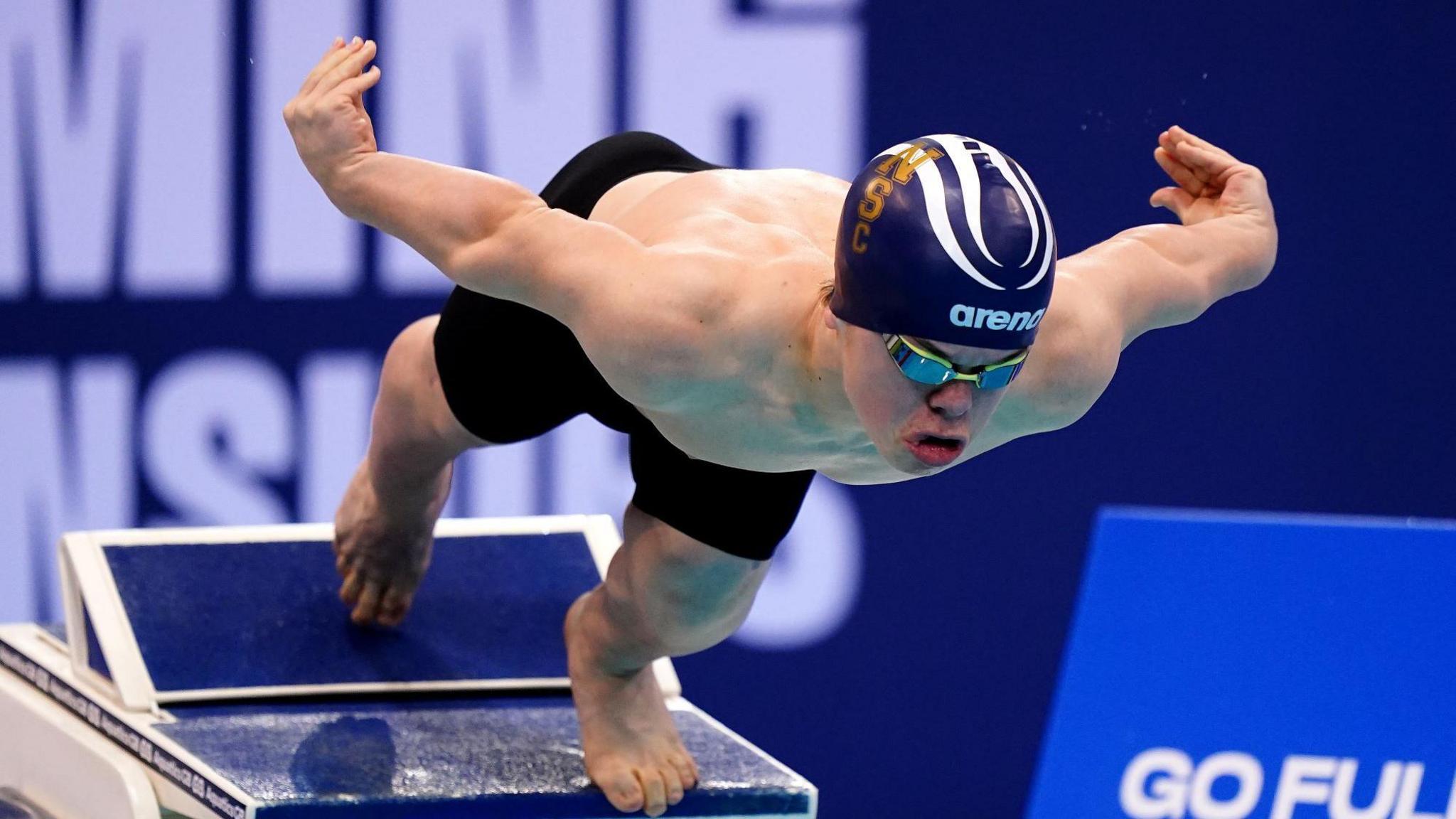 Bruce Dee diving into the swimming pool