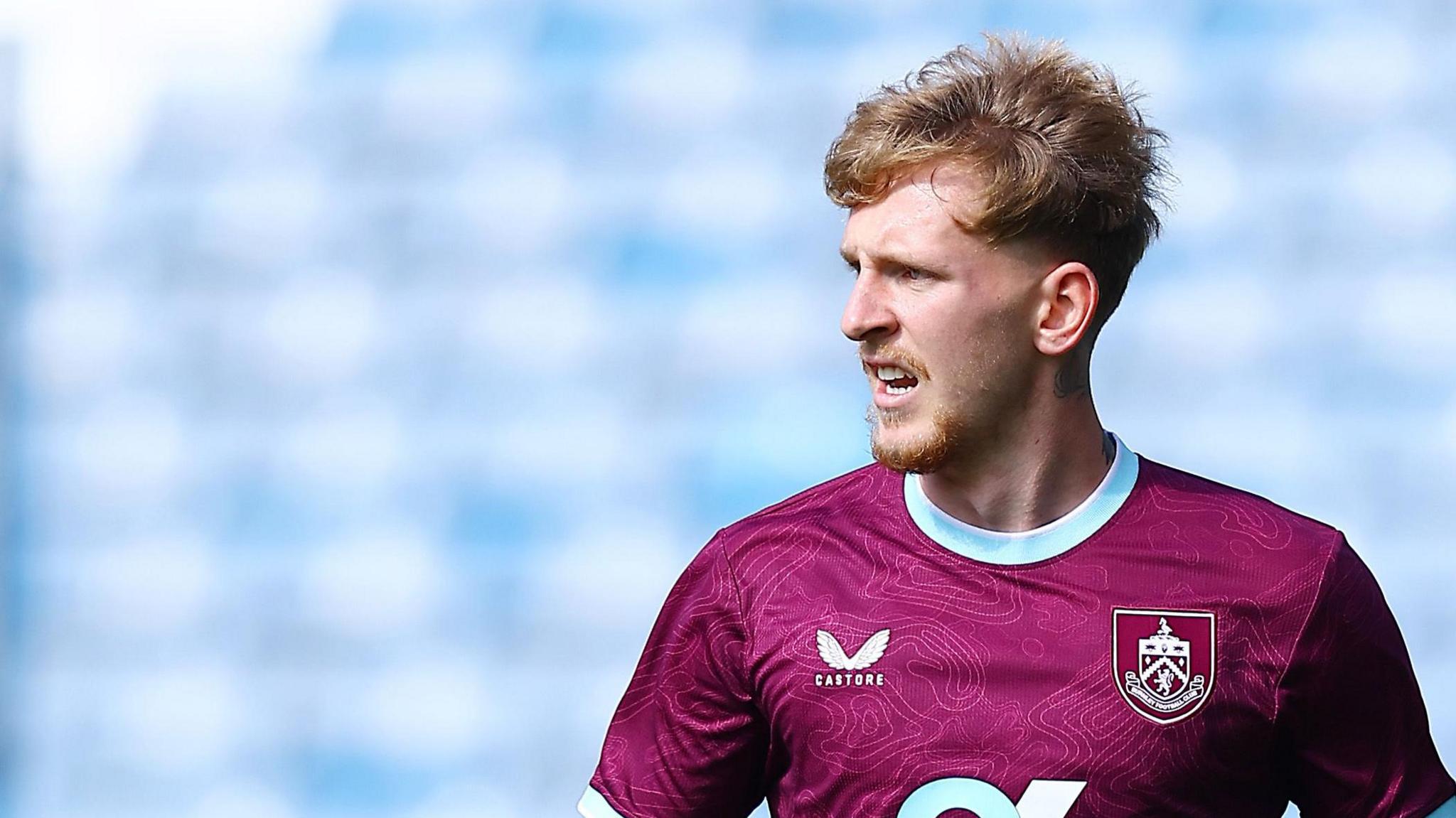 Logan Pye in action for Burnley during a pre-season friendly against Huddersfield Town