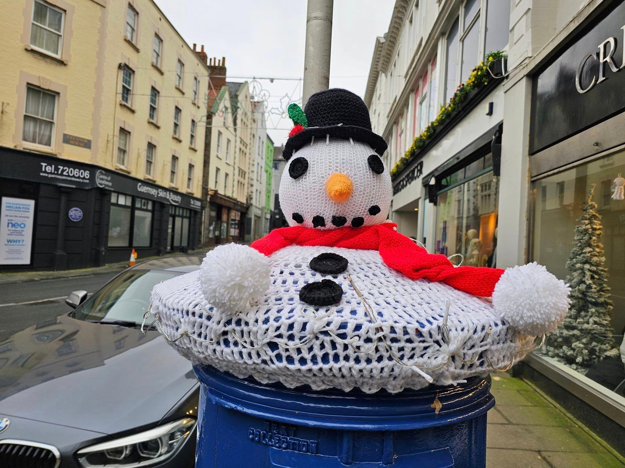 A melted snowman post box topper