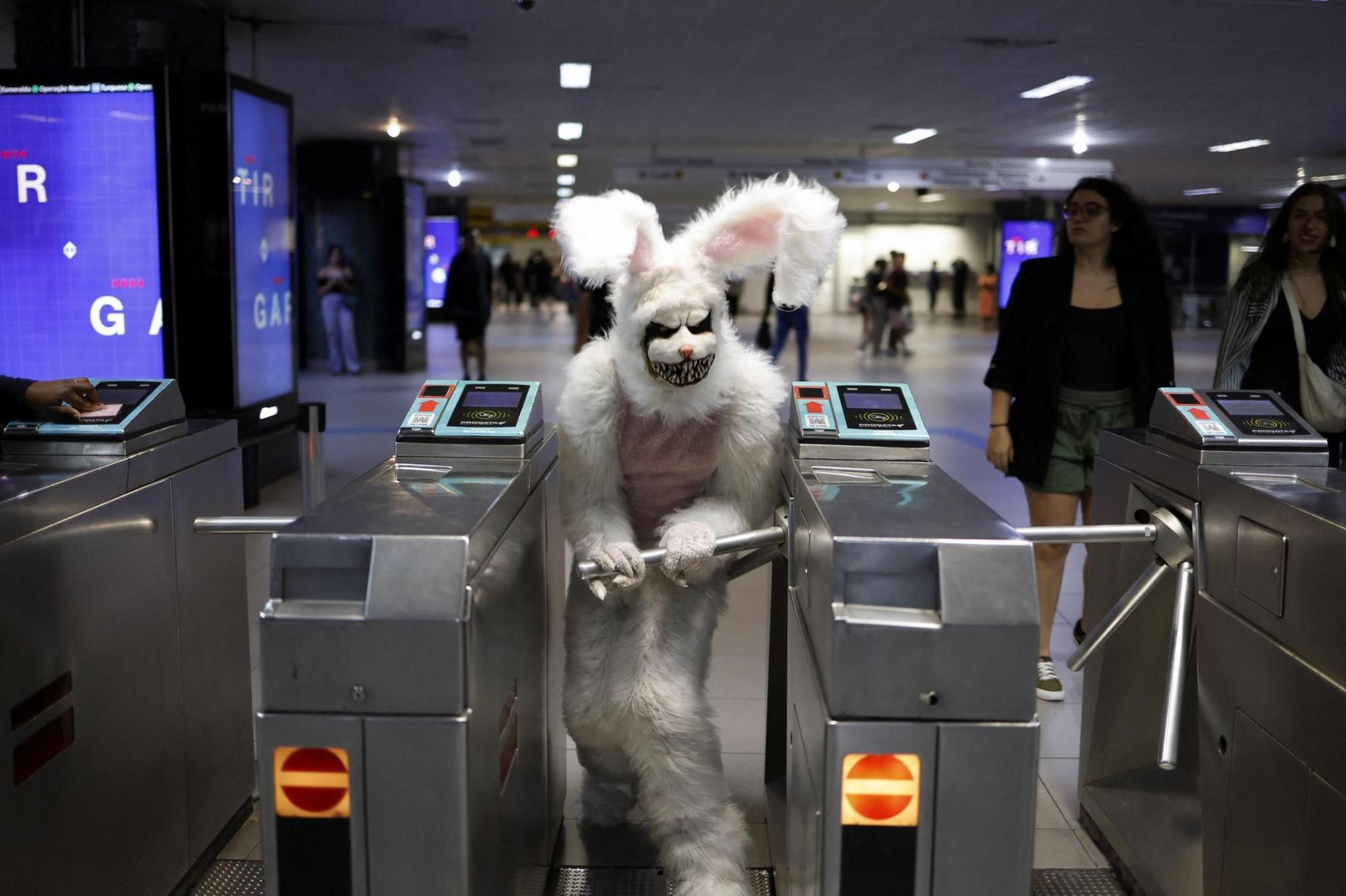 A person dressed up as a rabbit exits the subway in Sao Paulo, Brazil
