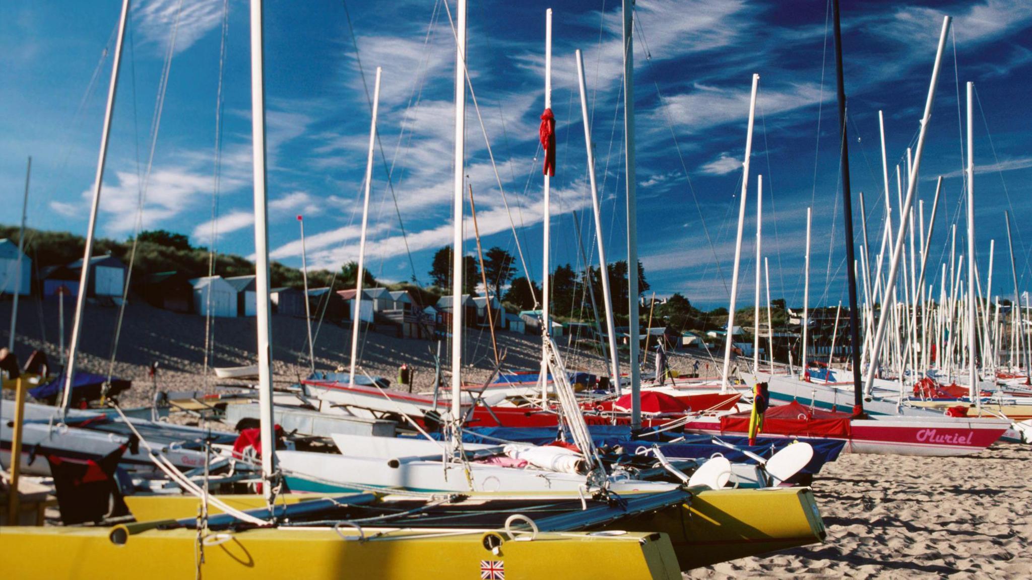 Dozens of boats on Abersoch beach on a sunny day.