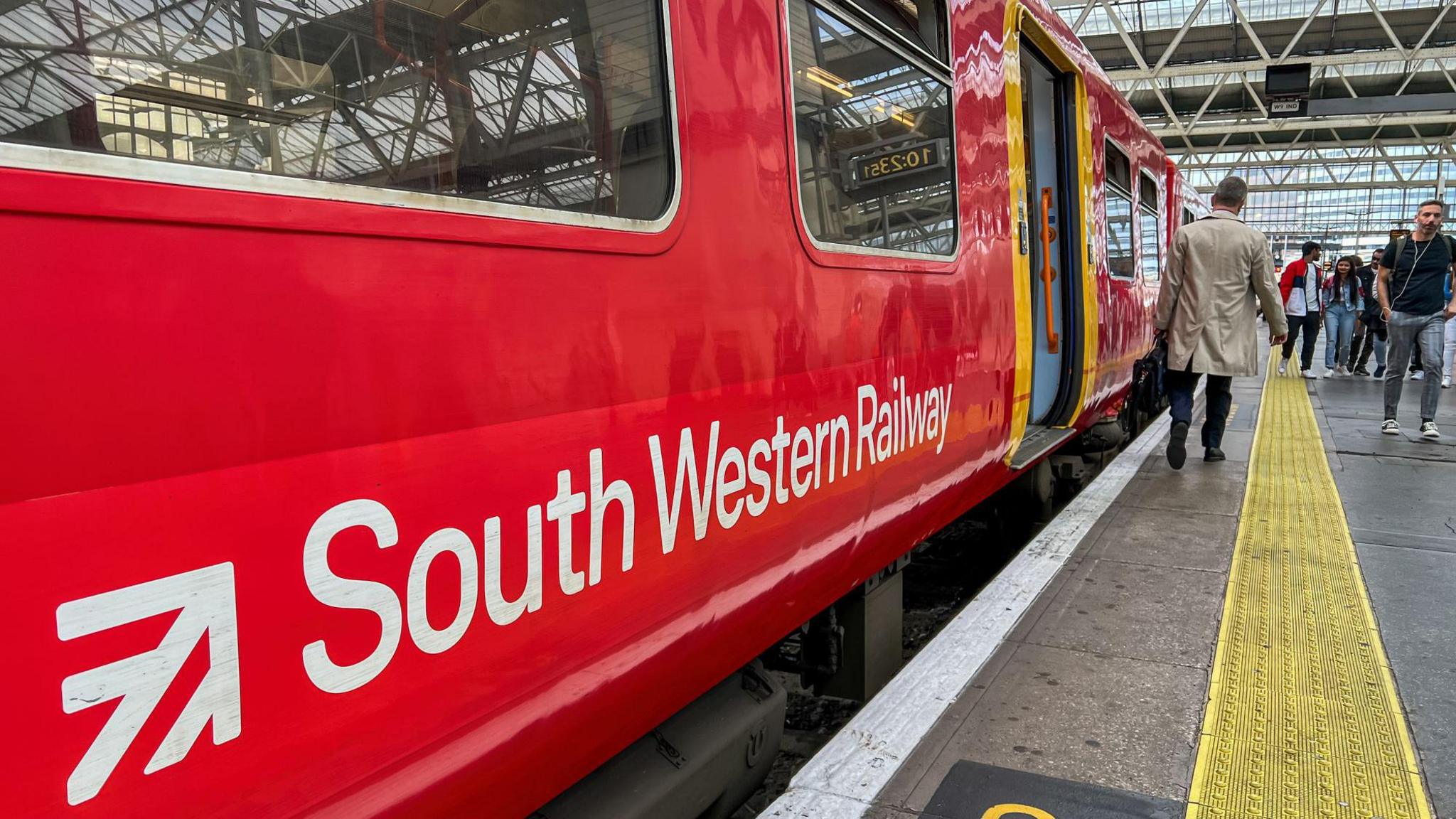 A red train of South Western Railway staying in Waterloo Station.