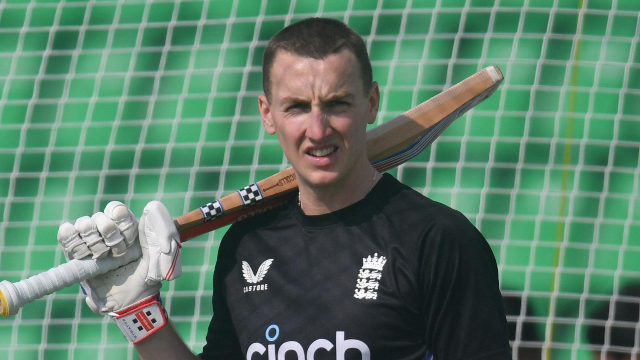 England batter Harry Brook rests his bat on his shoulder in training