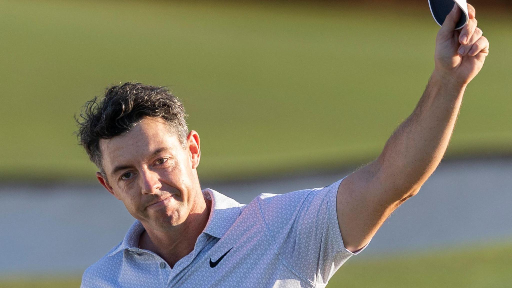 Rory McIlroy waves his cap to the Masters crowd