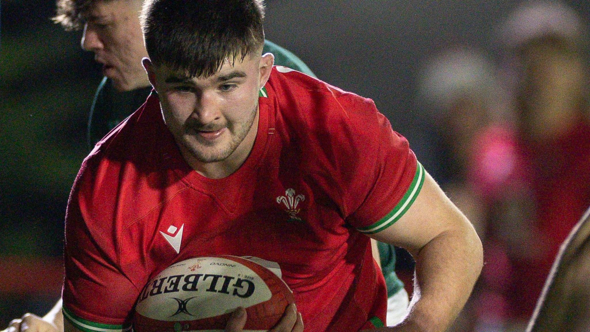 Harry Thomas in action for Wales Under-20s