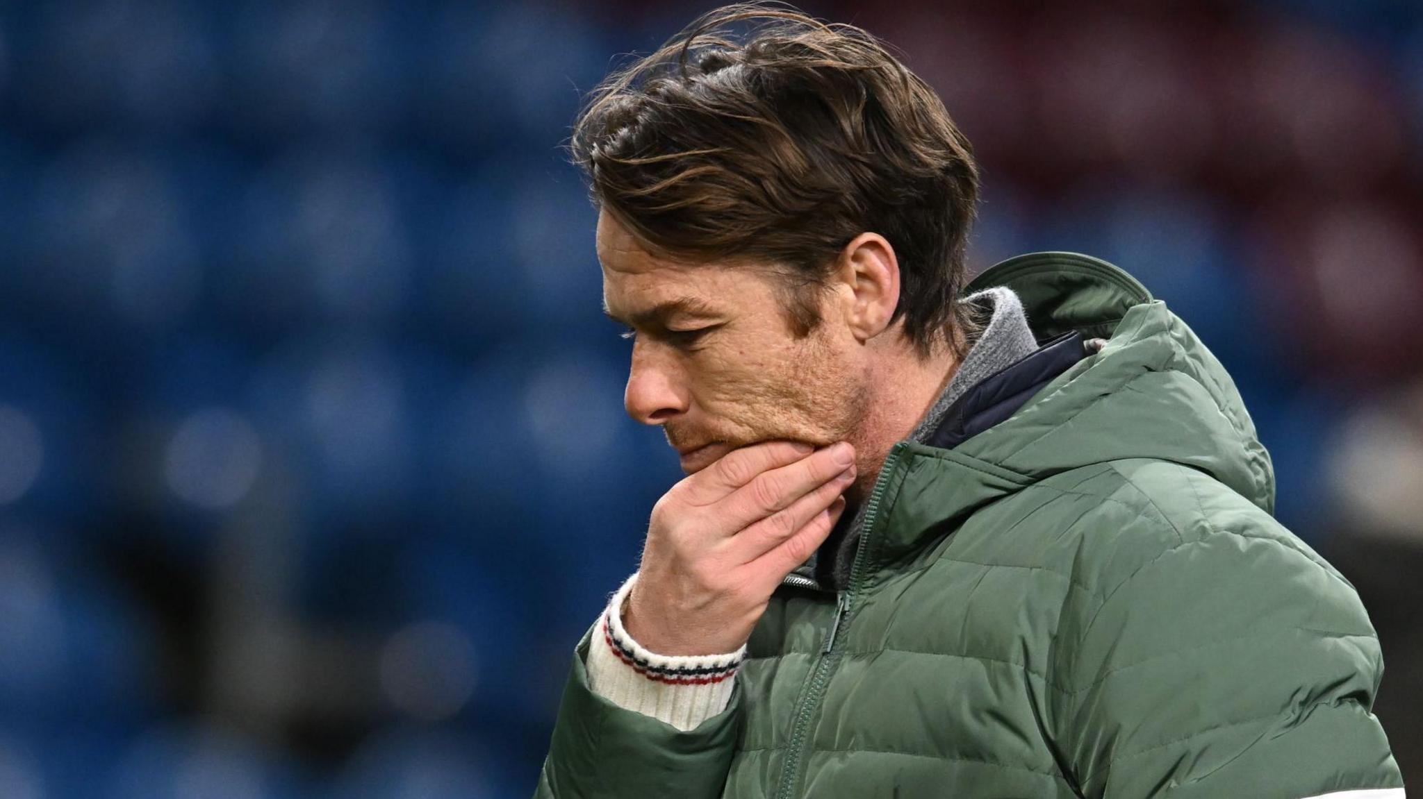 Burnley boss Scott Parker rubs his chin