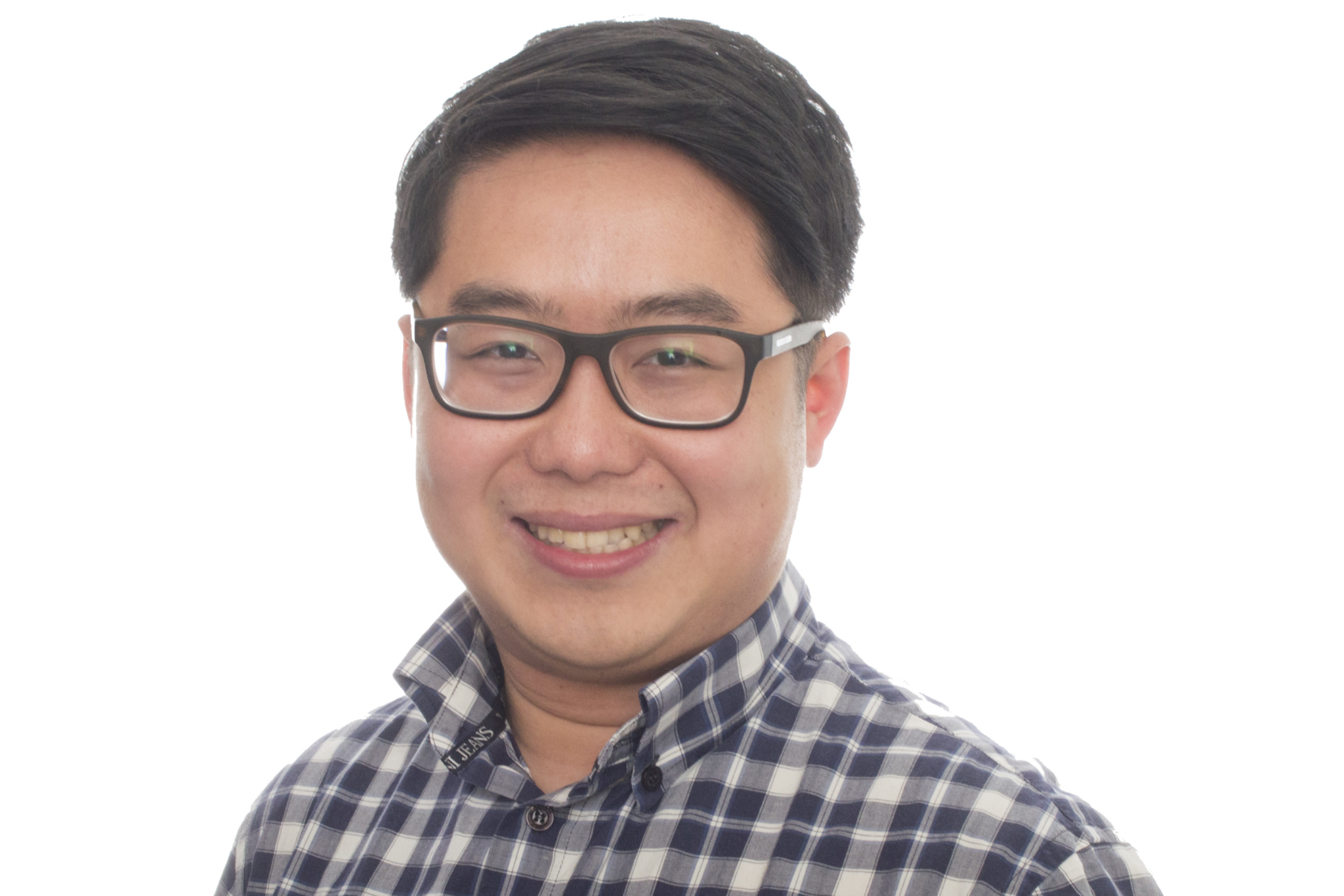 Dr Wong smiles directly at the camera. He wears black-framed glasses and a blue and white checked shirt.