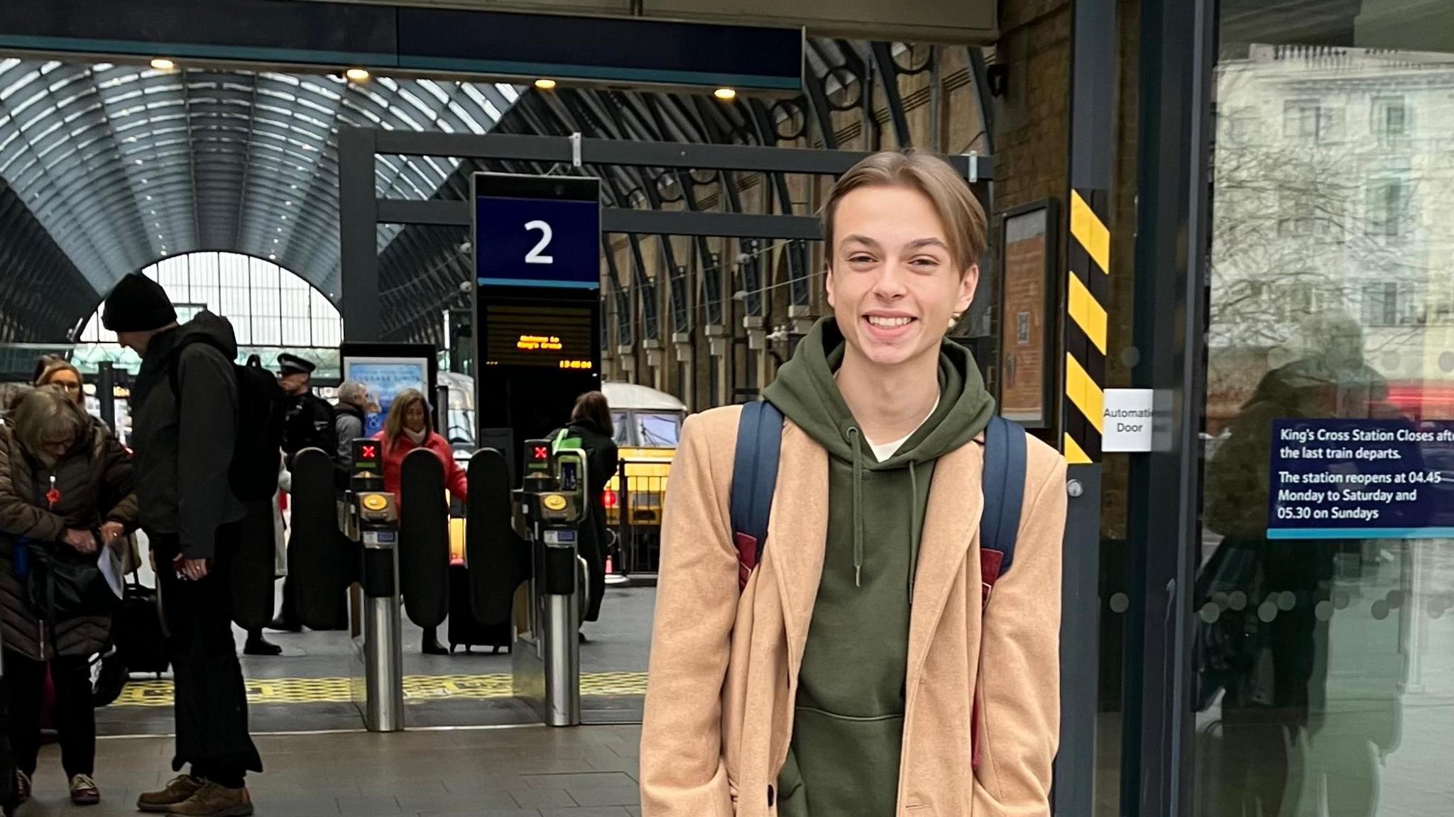 Luke Hall outside King's Cross train station in London