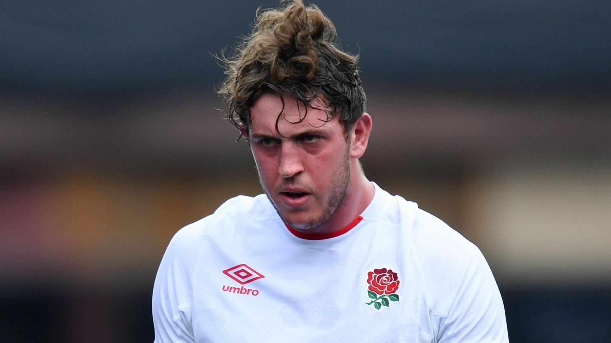 Alex Groves in a white England jersey