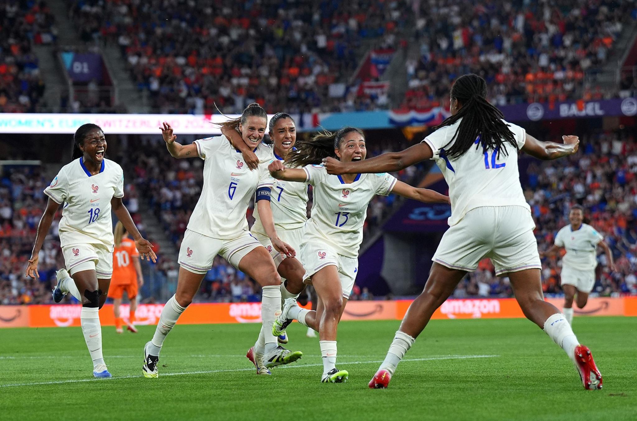 France's Sandie Toletti celebrates scoring her team's first goal with teammates during their match versus the Netherlands. Photo by Daniela Porcelli