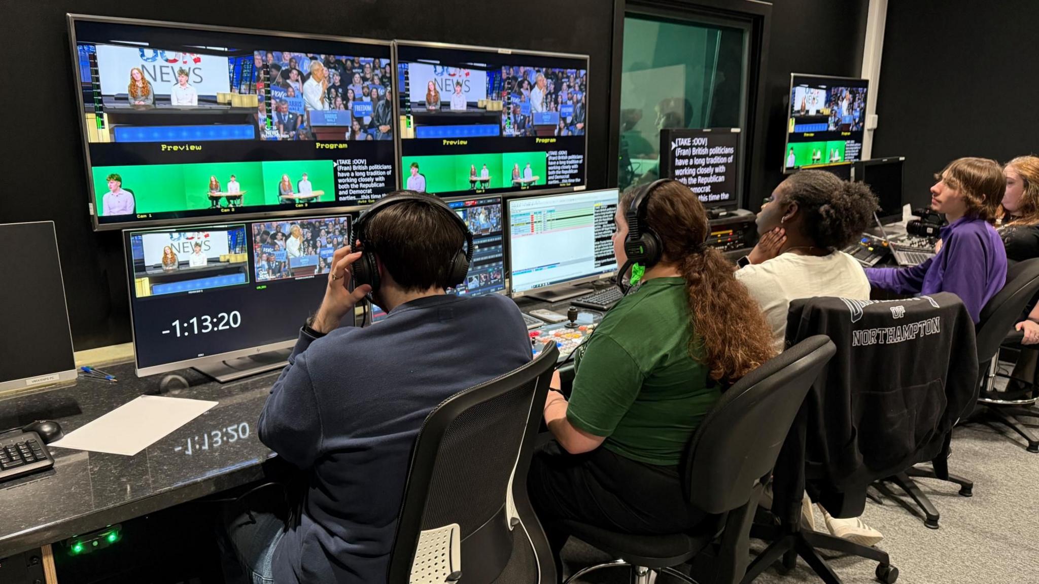 Five students sat in a row looking at numerous computer screens and monitors displaying the live updates, election figures and scripts for the presenters.