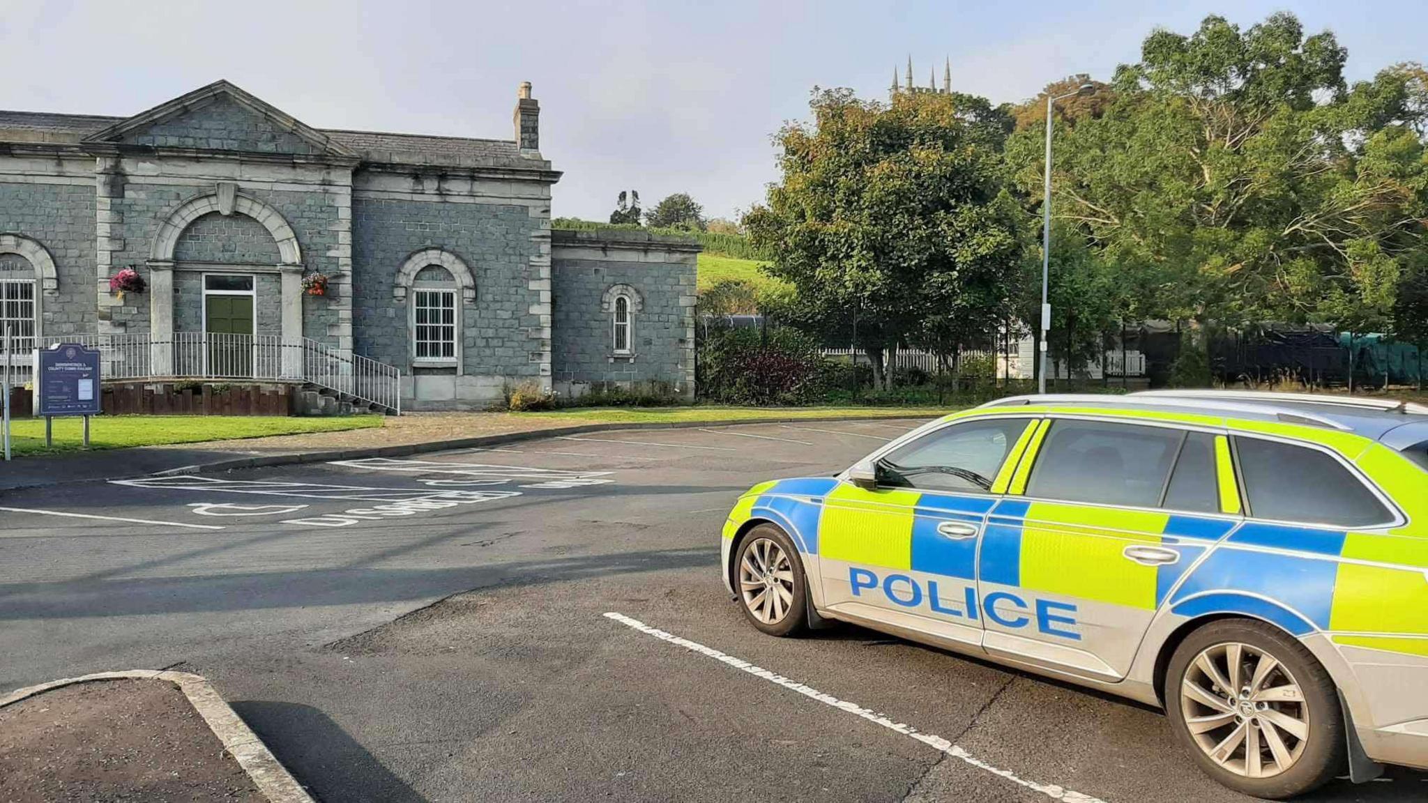 A police car sits outside Downpatrick and county Down railway 