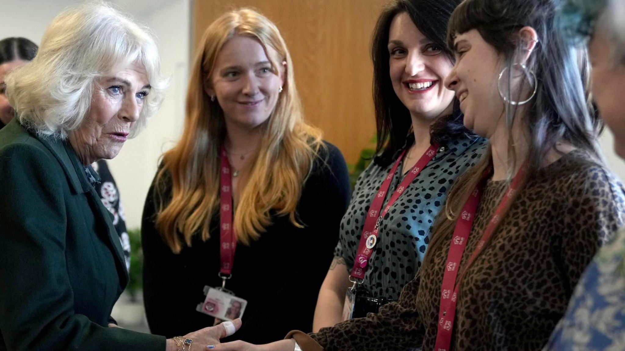 Queen Camilla meets three female members of staff during a visit to CoLab Exeter.