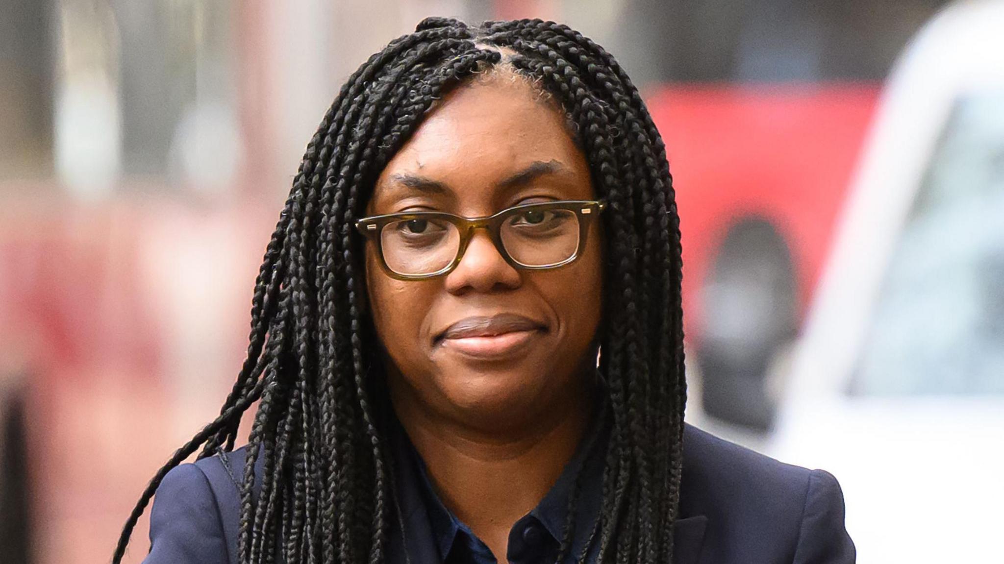 Close up of Kemi Badenoch wearing a dark blue suit arriving at the Post Office Inquiry