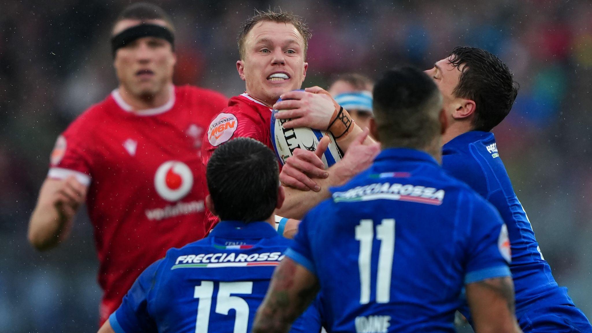 Wales and Italy players challenge for the ball