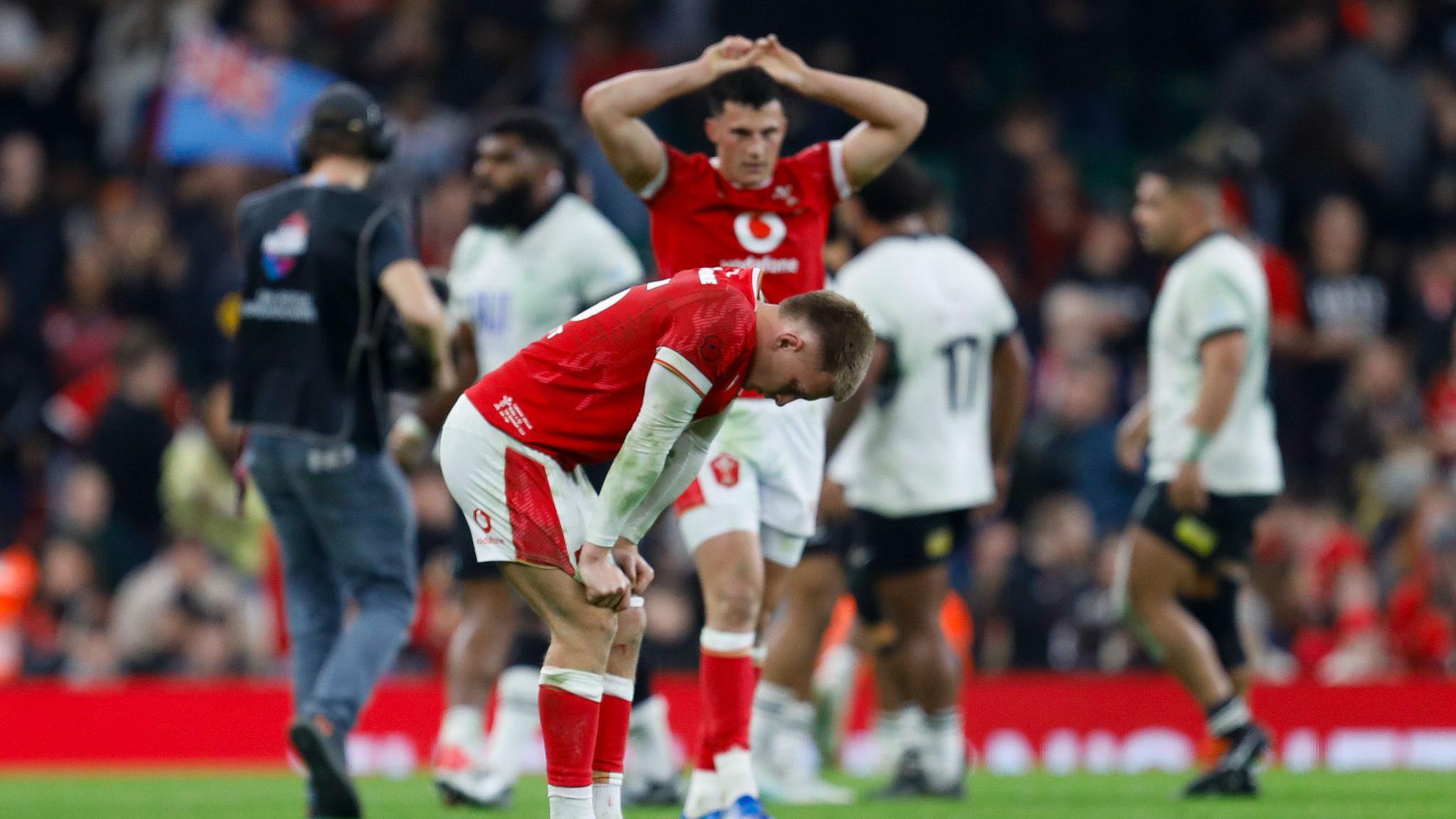 Wales players dejected after full-time