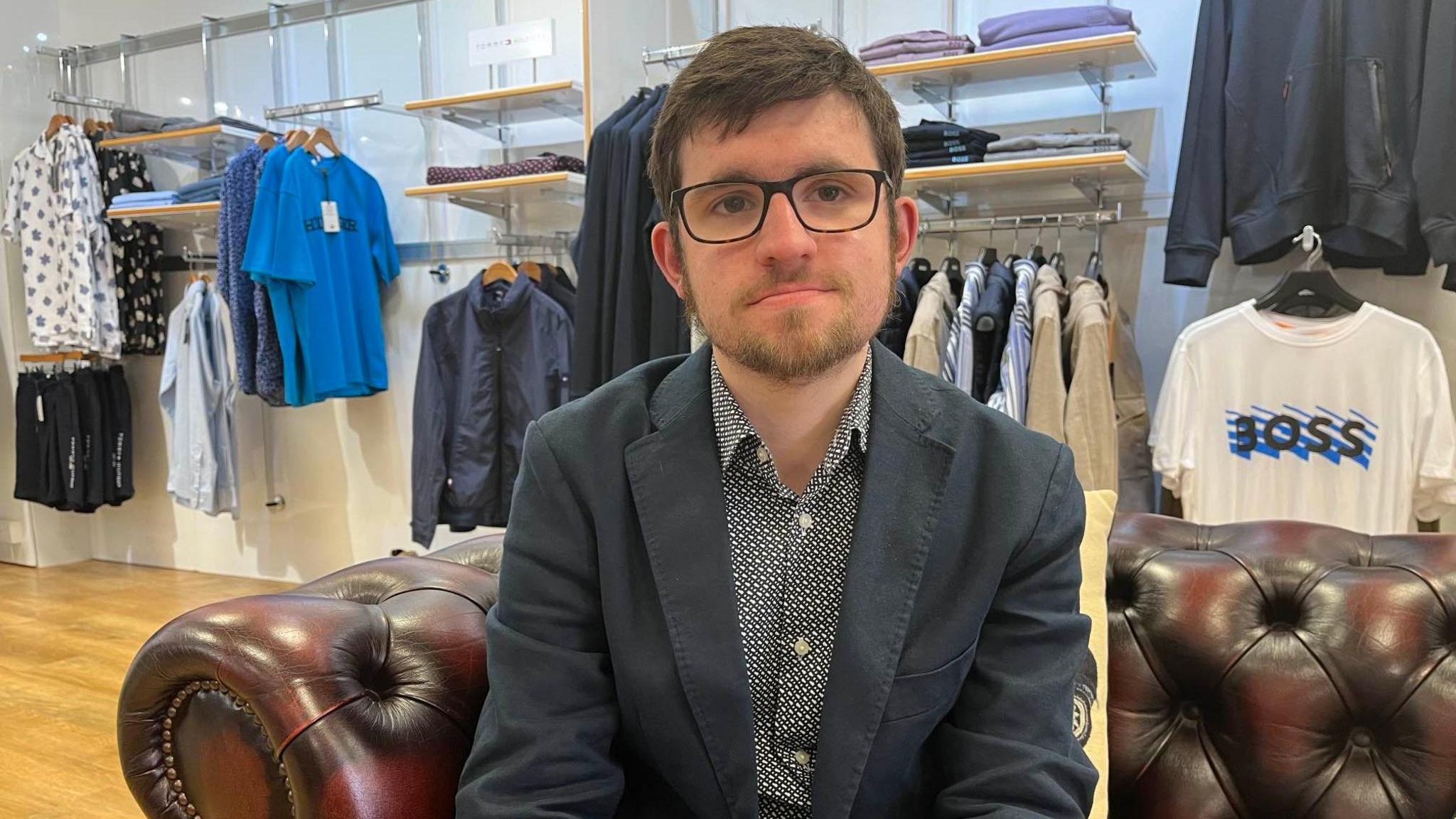 Alex Broadley inside the Broadley clothing store 