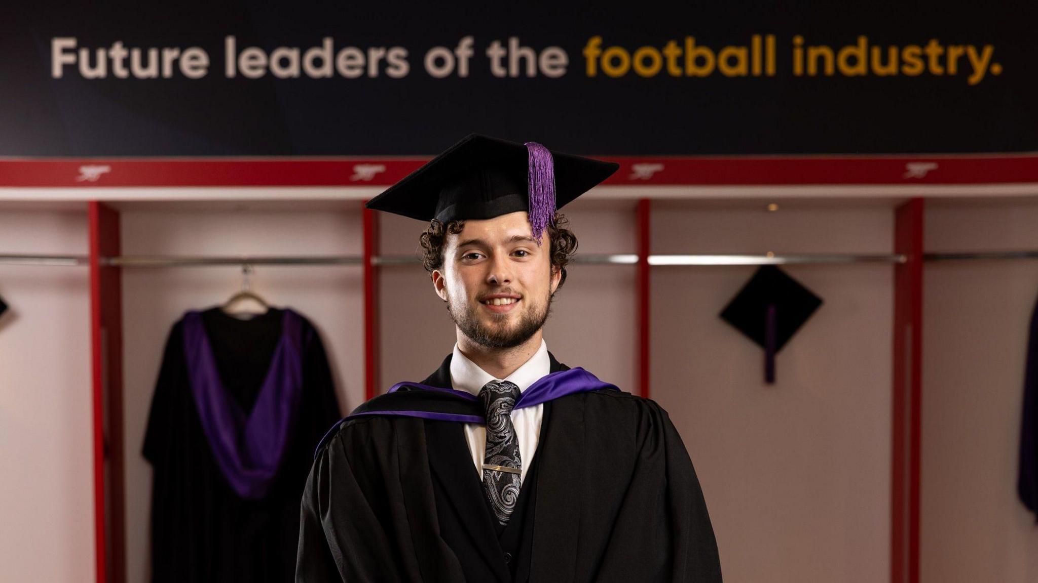 Luke Matheson poses after graduating with the PFA Business School