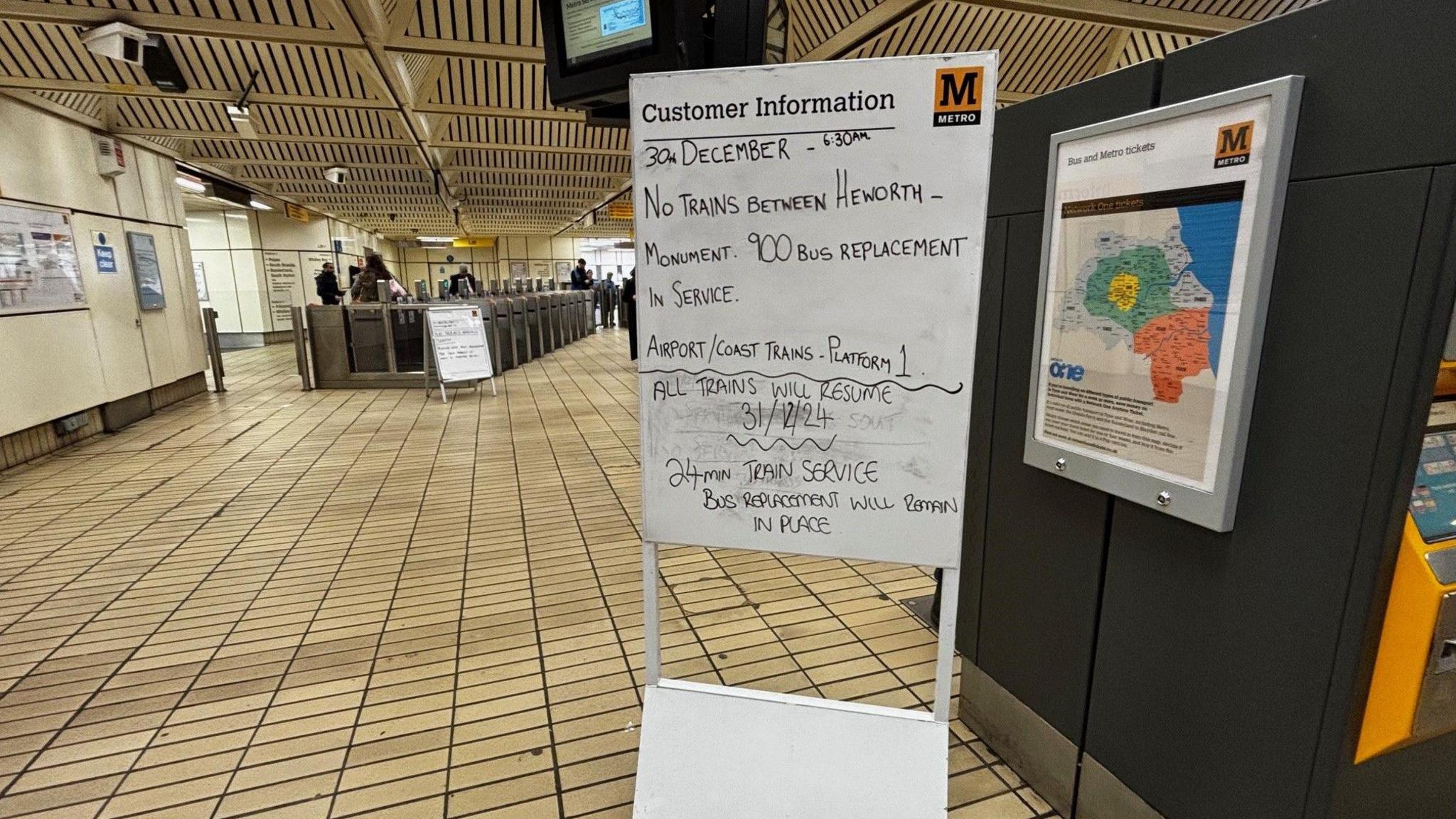 Sign in Metro station saying "No trains between Heworth and Monument. 900 bus replacement in service".