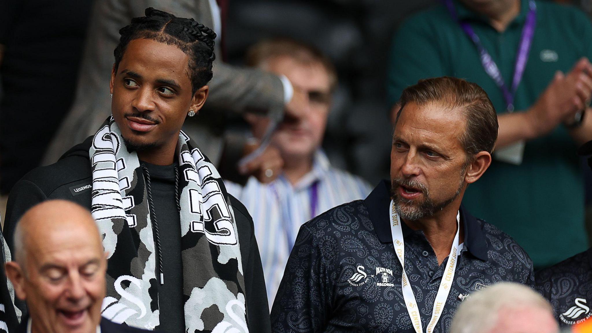 Cordell Broadus and Brett Cravatt in the Swansea directors' box