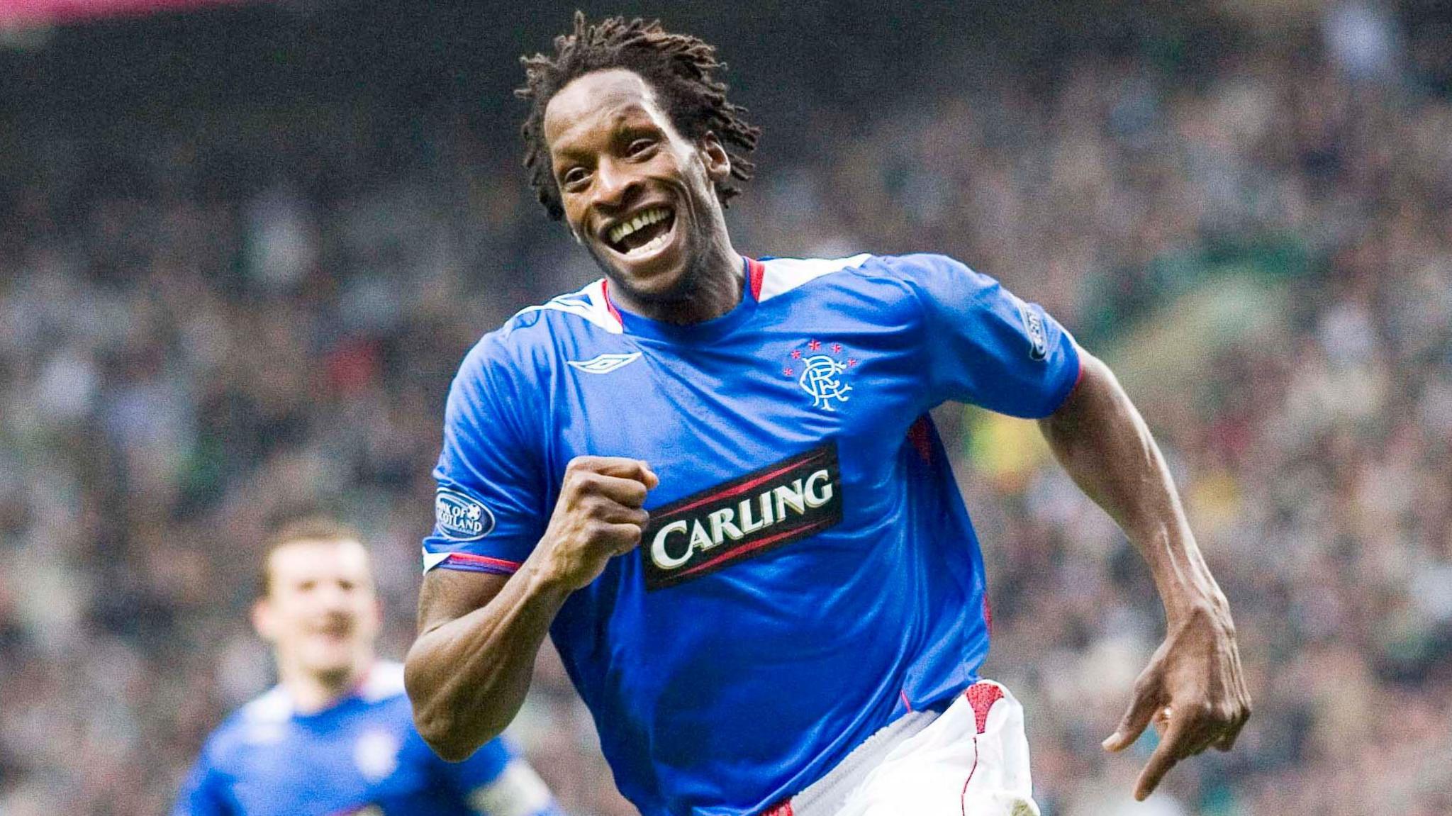 Ugo Ehiogu celebrates after scoring for Rangers against Celtic in 2007