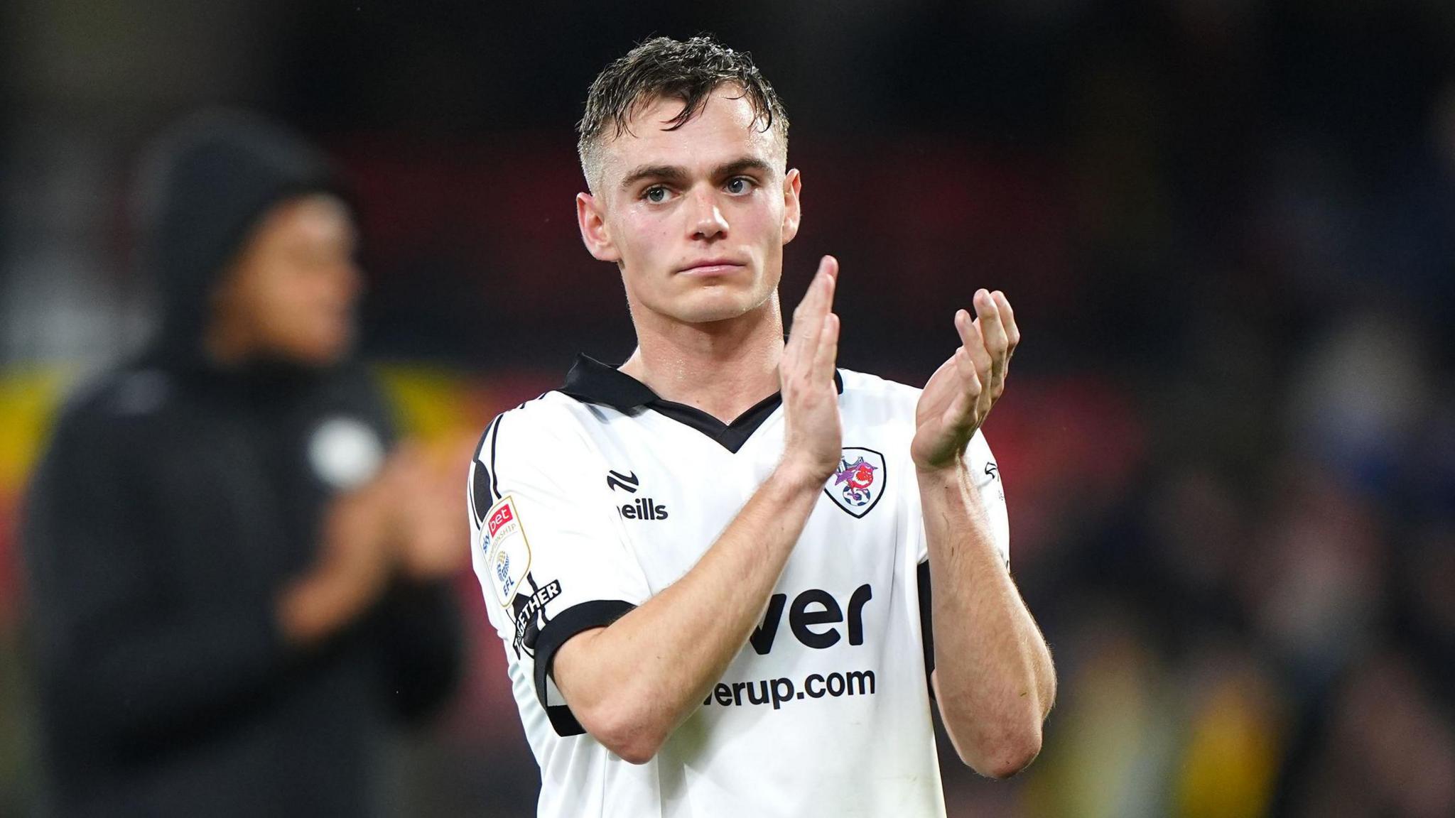 Scott Twine claps his hands at the end of a match