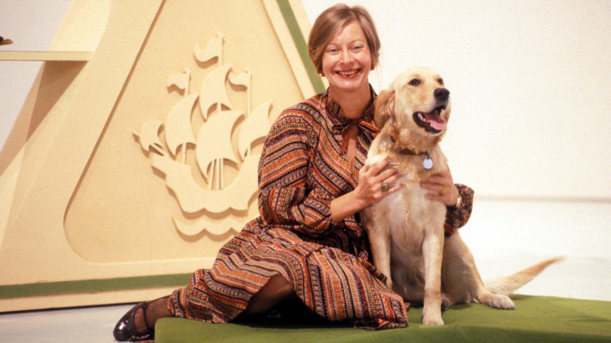 Biddy Baxter with Goldie the dog.