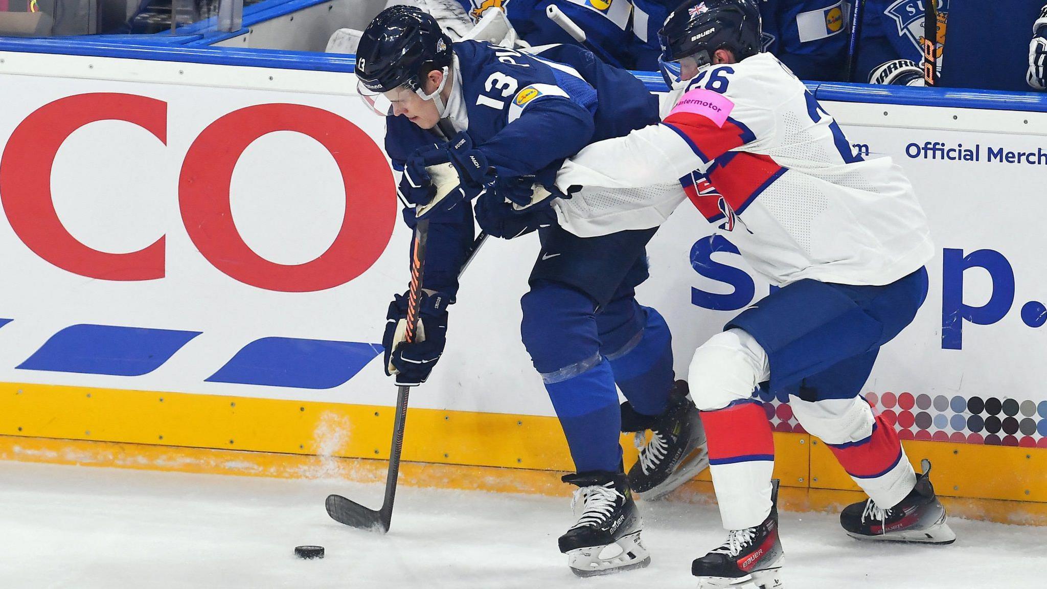 Britain's Evan Mosey challenges Finland's Jesse Puljujarvi at the Ice Hockey World Championship in Czech Republic