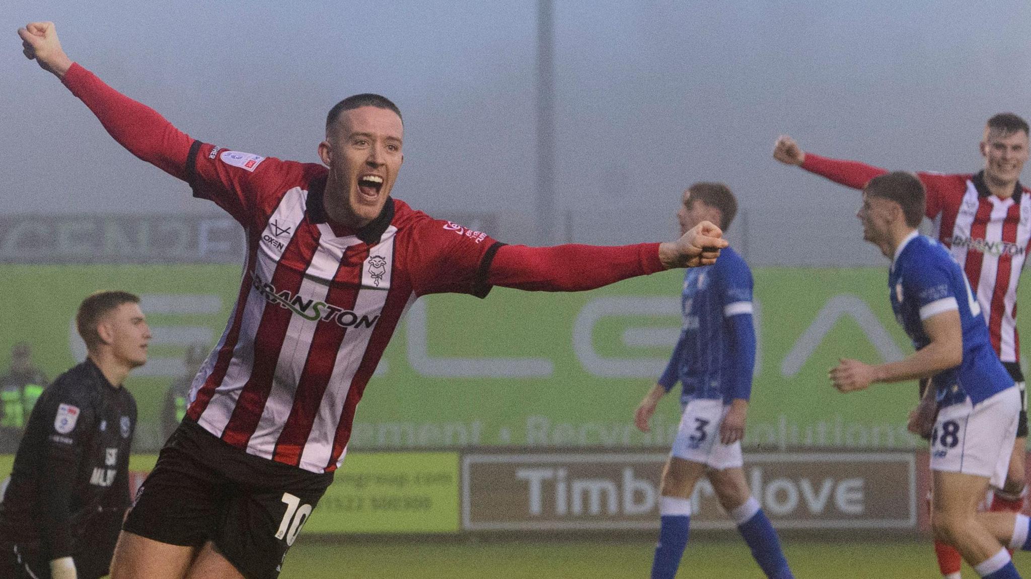 Jack Moylan celebrates scoring for Lincoln City