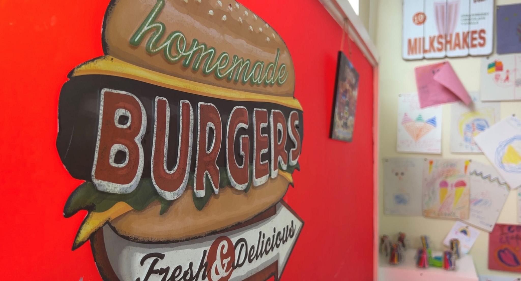 A burger poster inside Gelatis diner