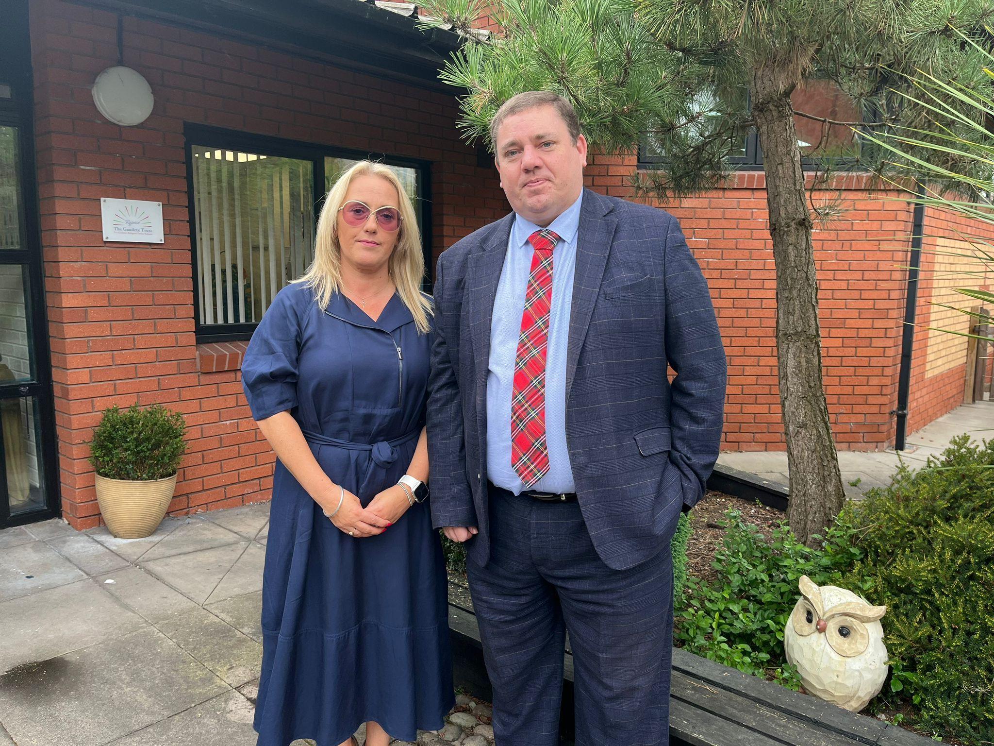 Chair of Governors Loraine Atherton and head teacher Dan Hood stand in front of the school in Stoke-on-Trent