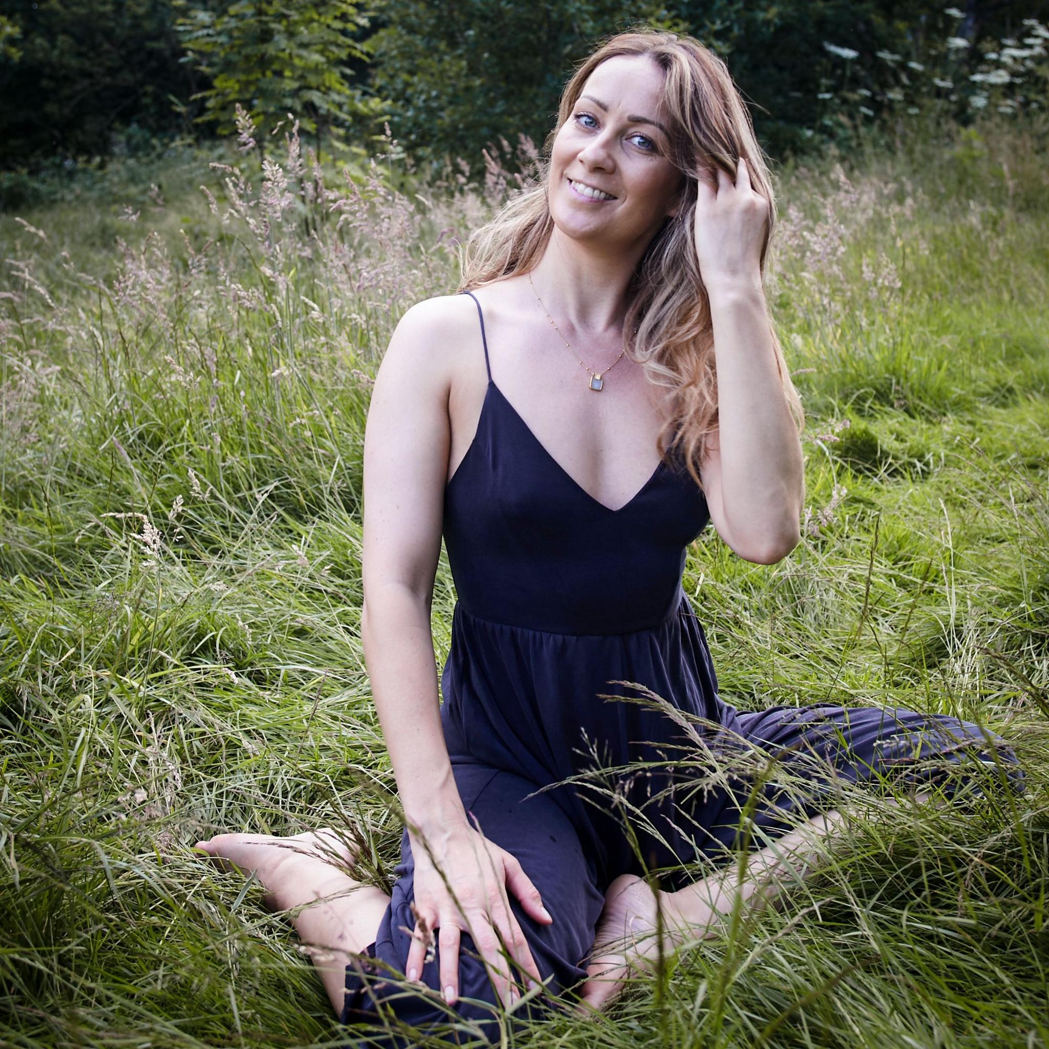 Eirian Collinge sitting outside in a park