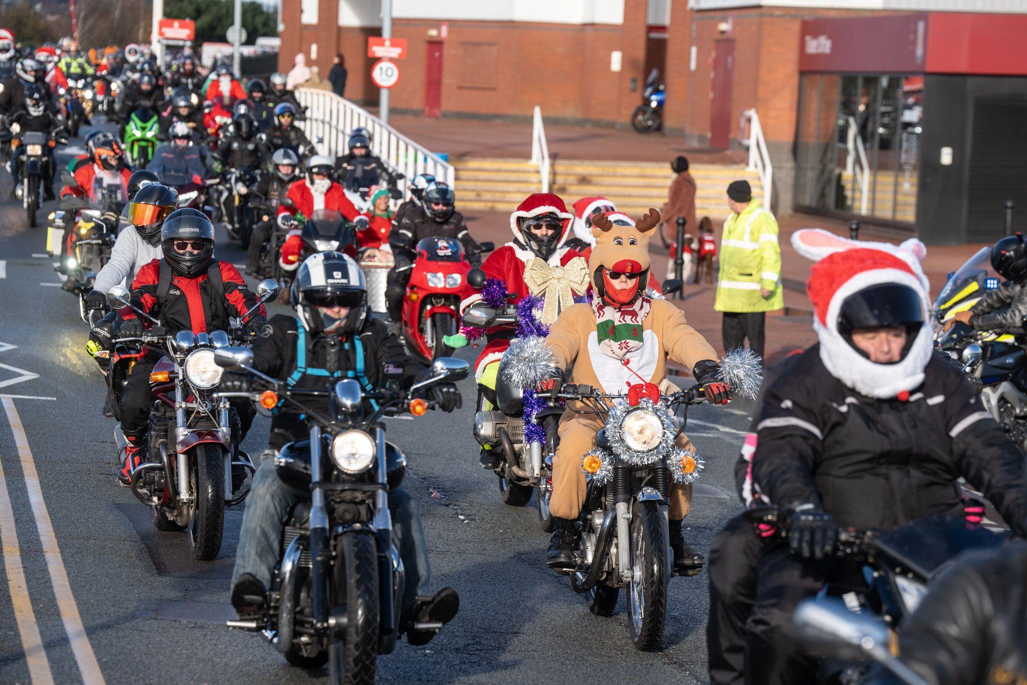 A group of bikers set off on a charity motorcycle ride from the Bet365 Stadium car park. Among them are those dressed in Santa hats and one dressed as a reindeer.