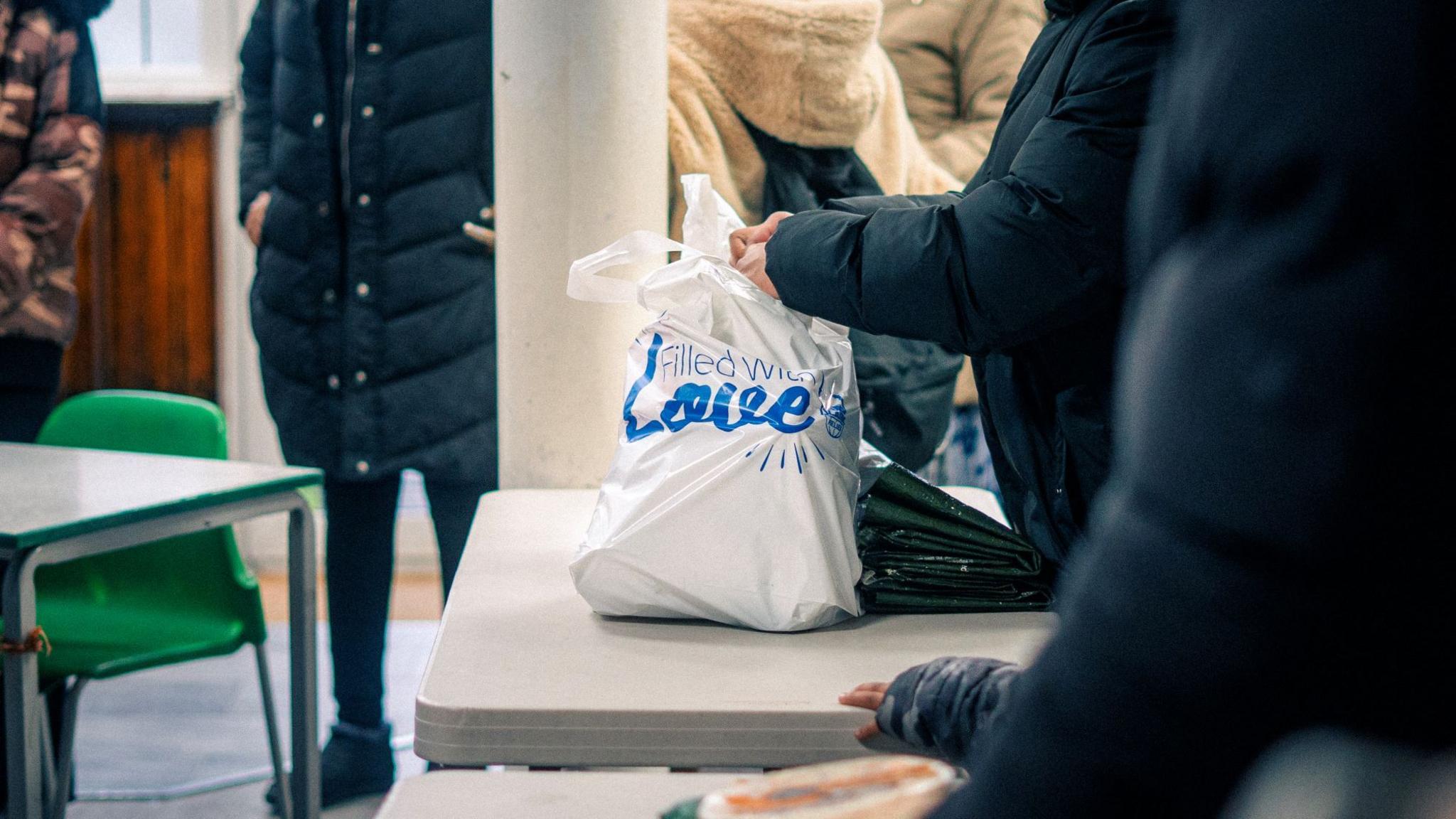 A bag containing food sitting on a table