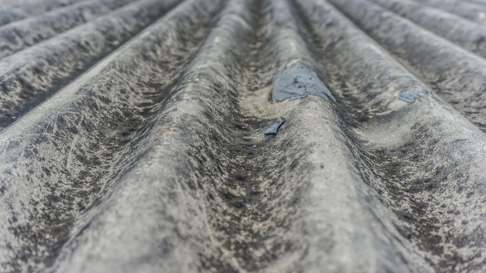 Section of grey waved asbestos roofing