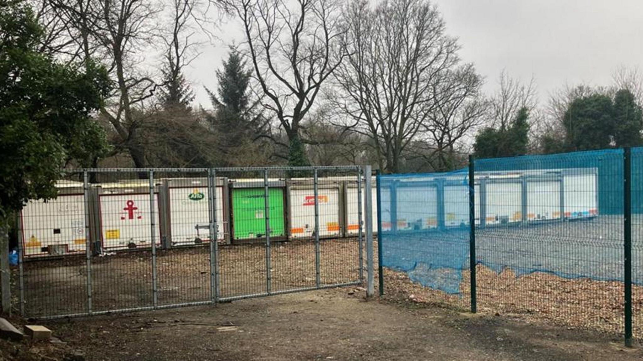 Large containers behind a gate