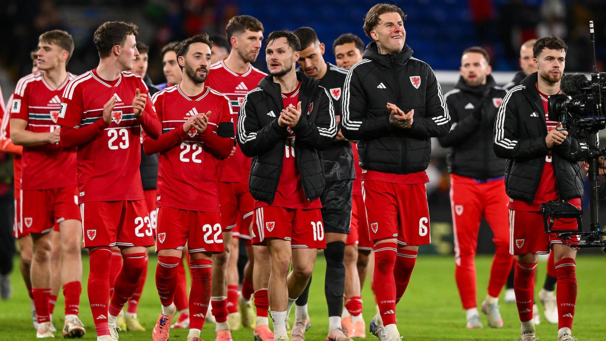 Wales players on a lap of appreciation after their win over North Macedonia in November 