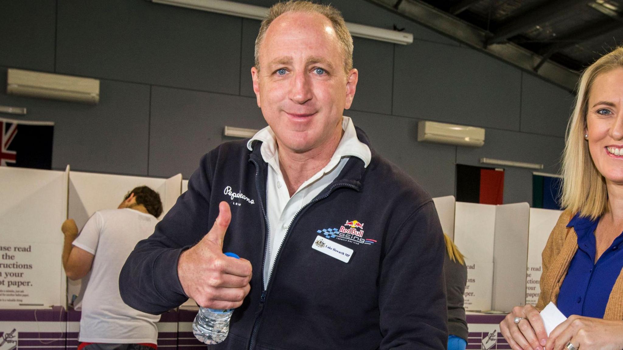 Luke Howarth giving a thumbs up when voting in 2016