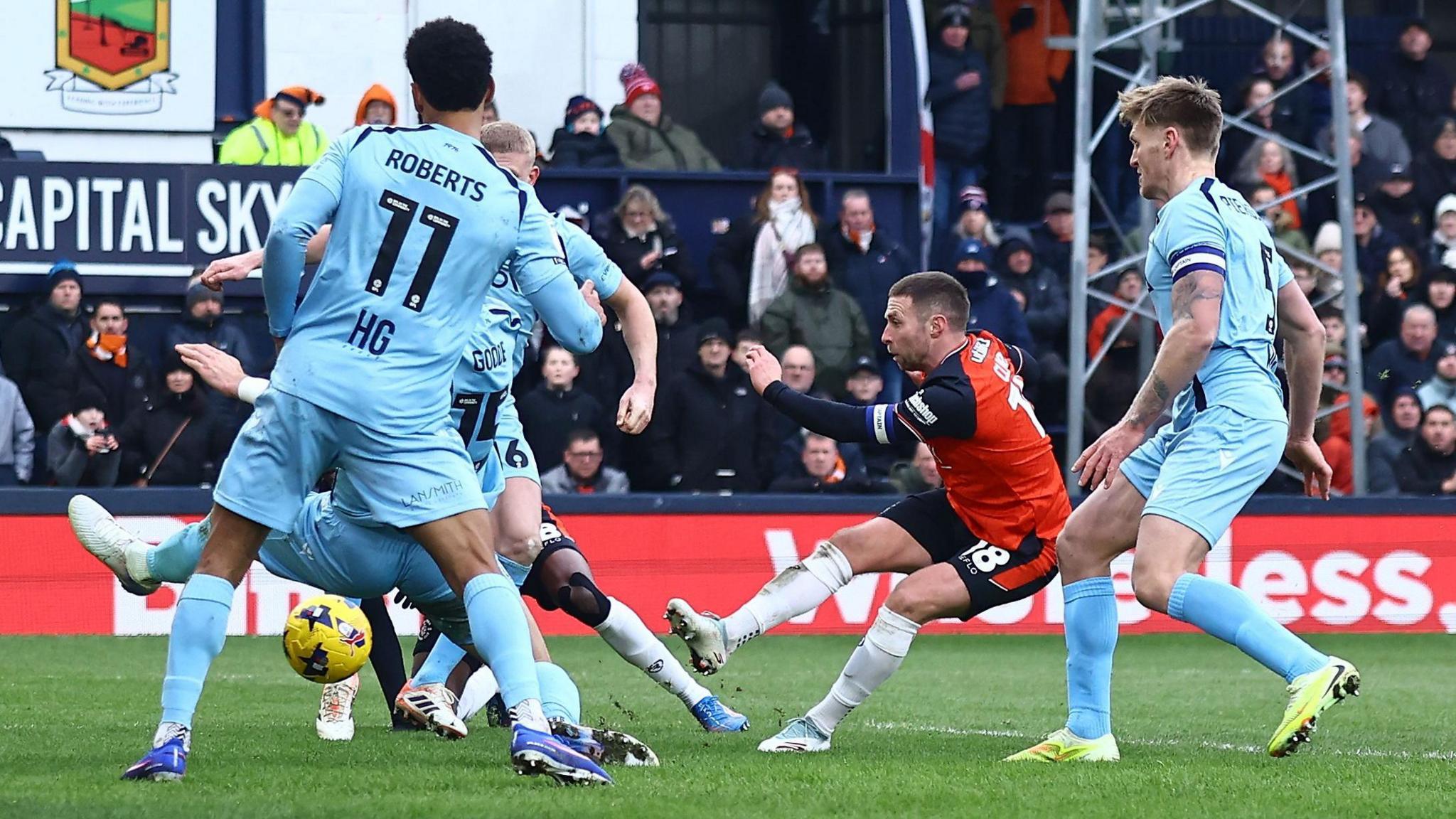 Jordan Clark of Luton Town scores