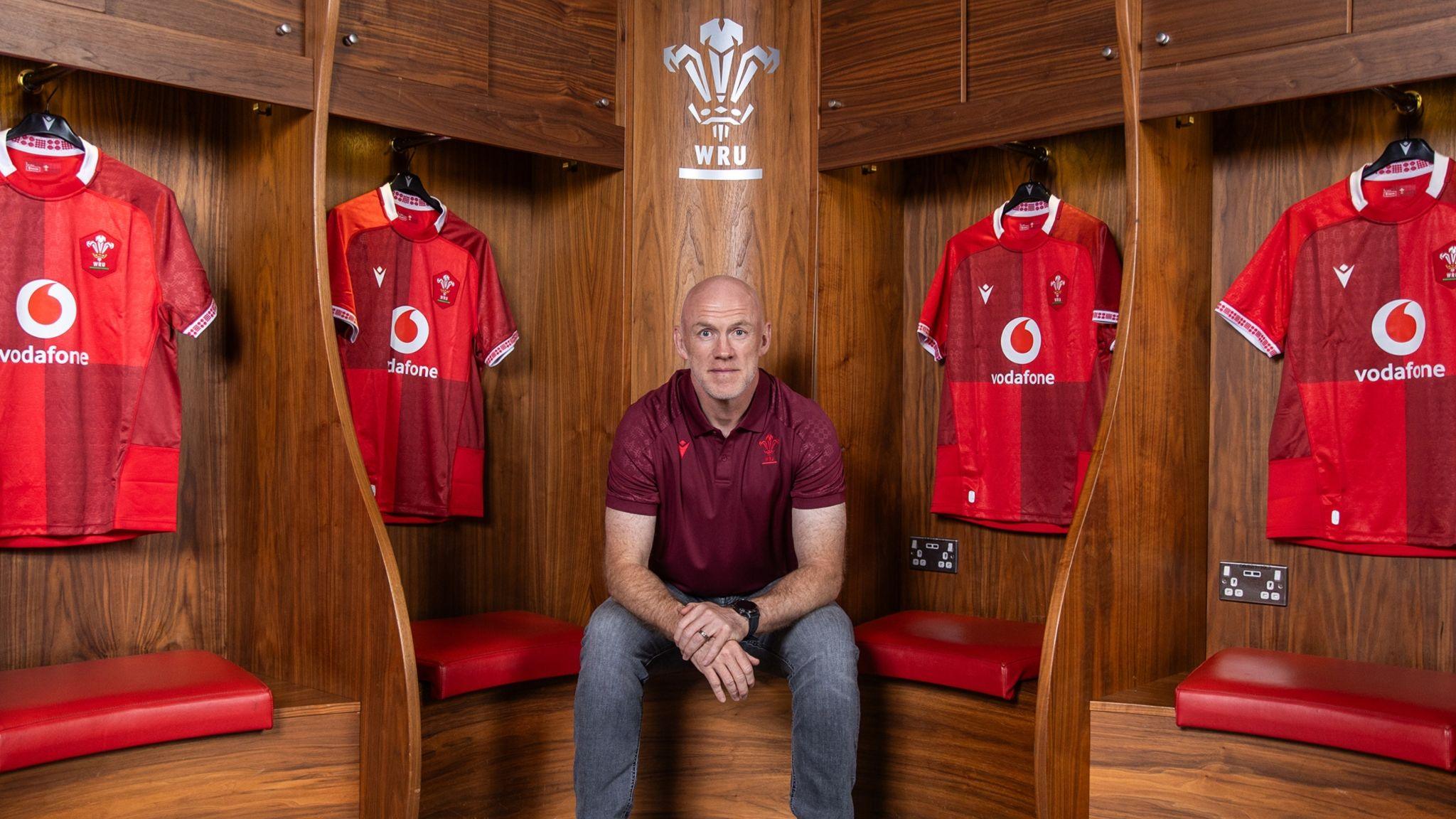 Wales senior mens head coach  Steve Tandy sat in the dressing room at Principality Stadium with hung up Wales jerseys