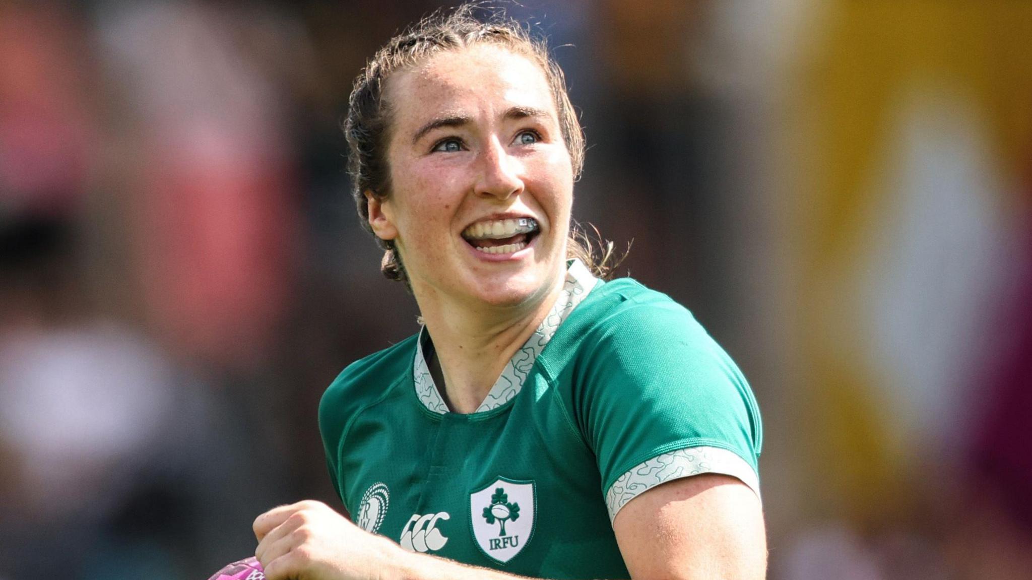 Eve Higgins celebrates after scoring a try against Japan on Sunday