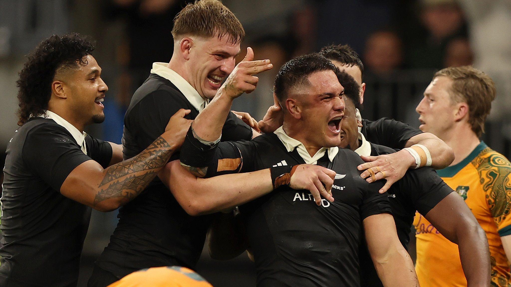 New Zealand's Quinn Tupaea celebrates scoring a try against Australia in Perth