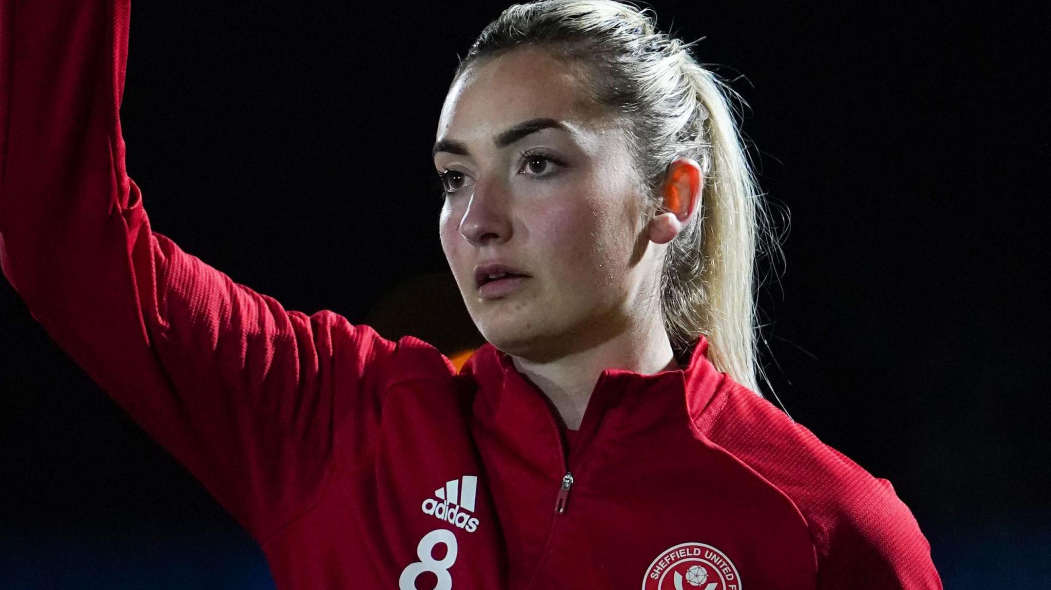 Woman in football kit